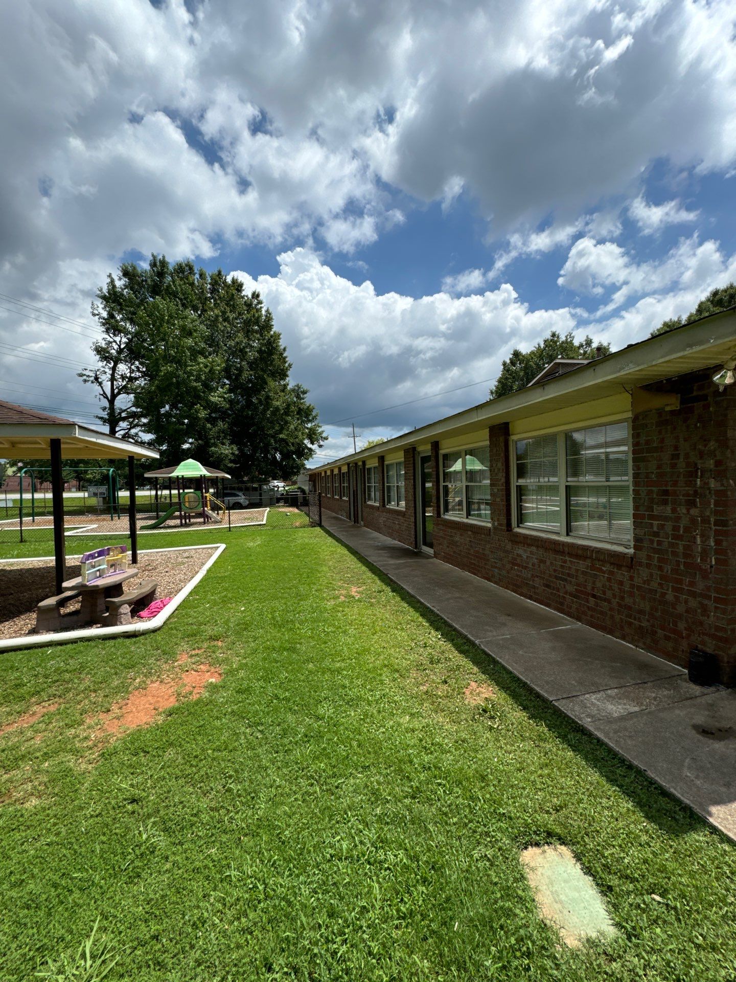 Commercial Exterior Brick and Stucco Painting in Fayetteville by Swift Home Renovations