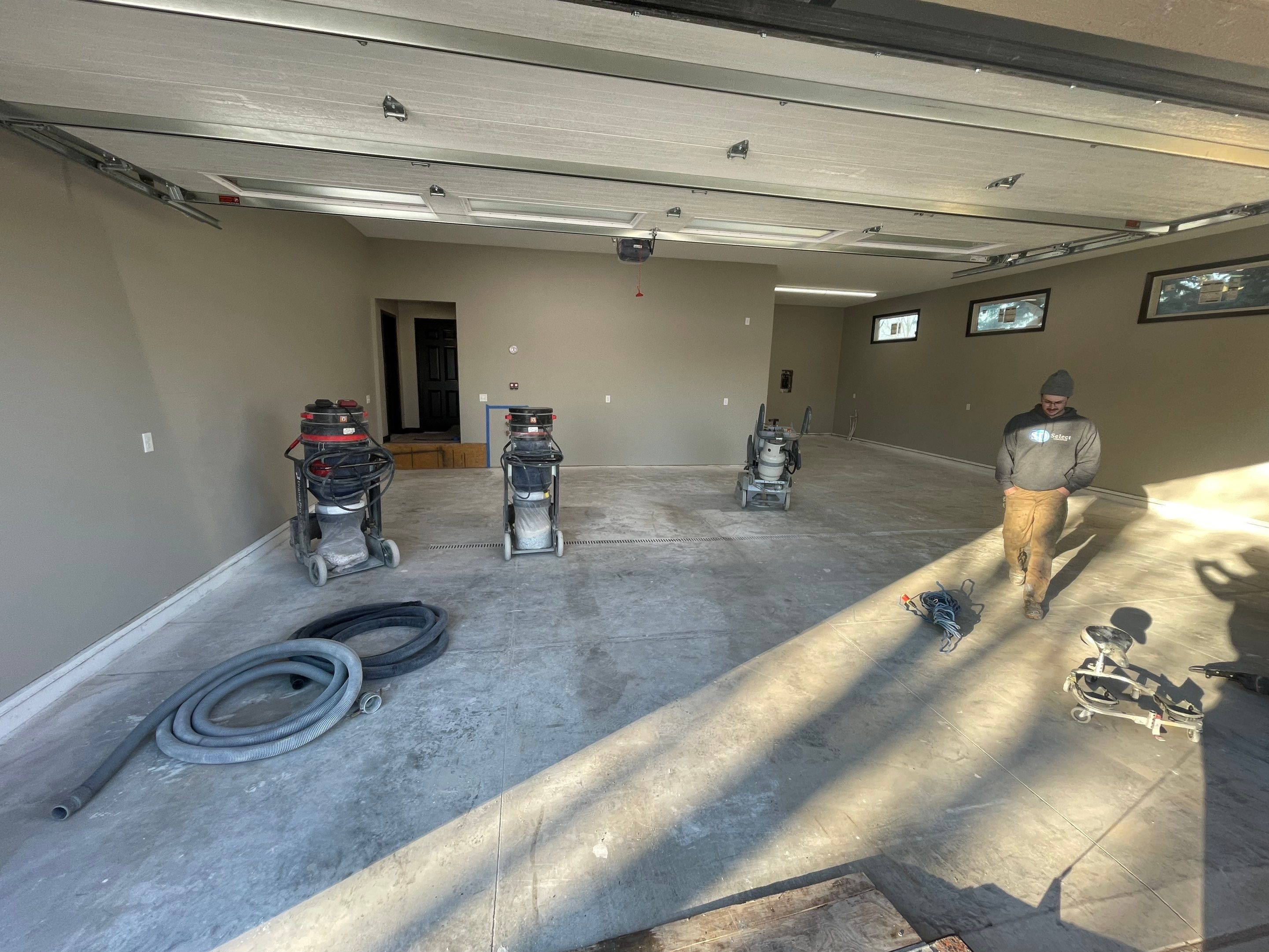 Decorative Flake Concrete Coating Installation in North Sioux City by Select Painting, Coatings & Garage Cabinets
