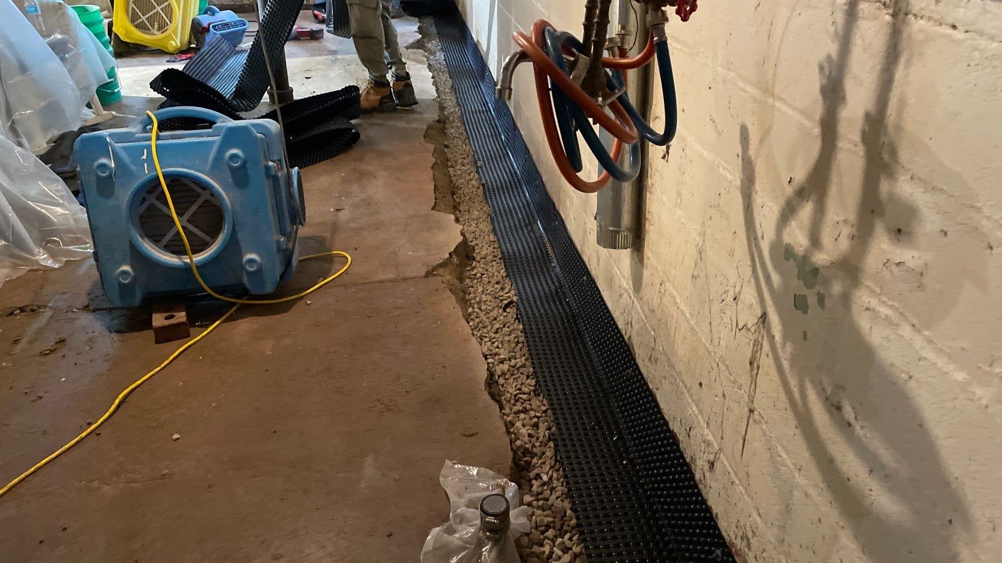 Interior Drain Tile & Sump Pump System in North Minneapolis by Waterproofing Northeast