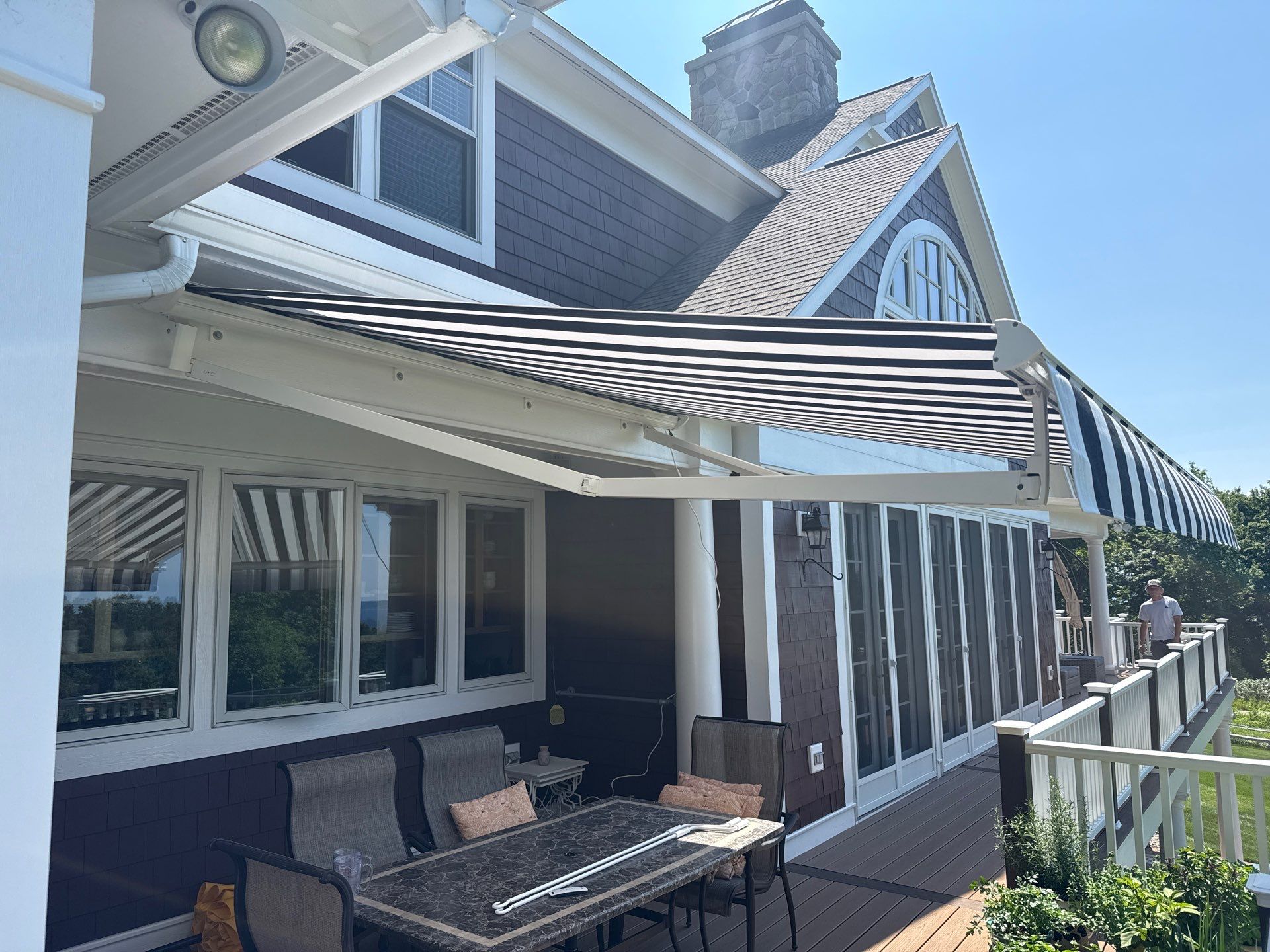 Sunesta Retractable Awning Installation in Harbor Springs by Rainbow Seamless Systems