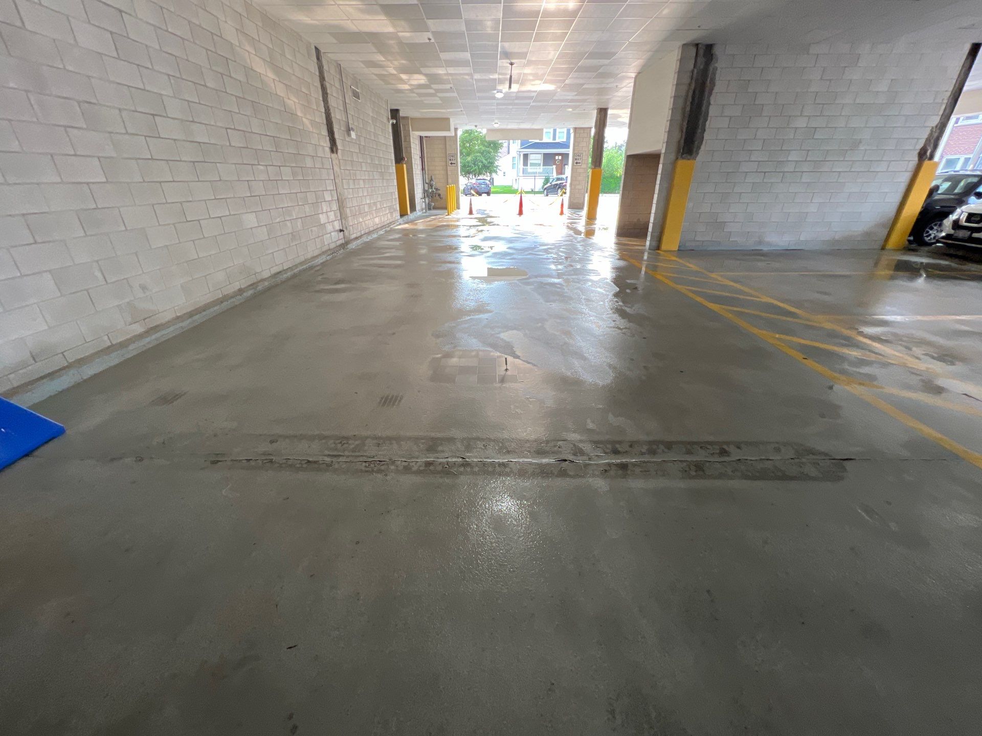Parking garage using Hot water by Northern Power Washing LLC.