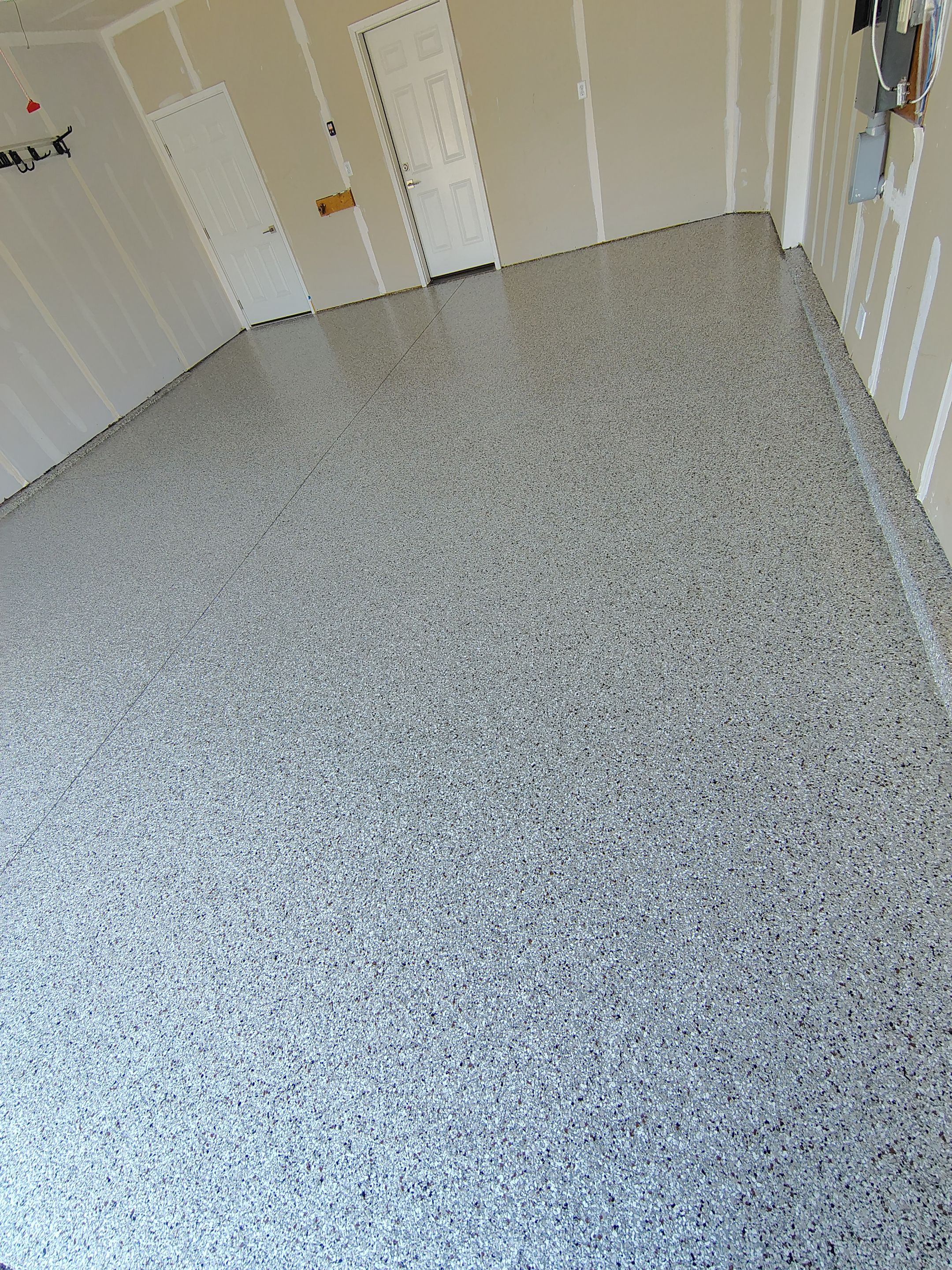 Custom Epoxy Garage Floor and Patio Coating in Sioux Falls by Select Painting, Coatings & Garage Cabinets
