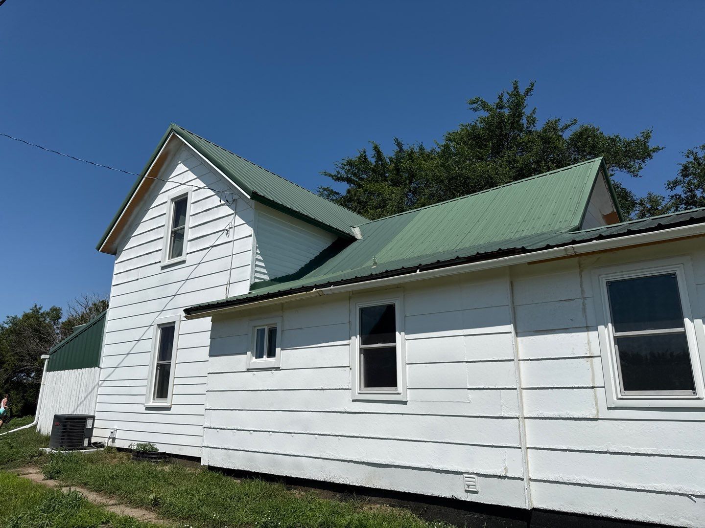 Standing-Seam Metal Roof and Vinyl Siding in Pender, NE by Crows Roofing LLC
