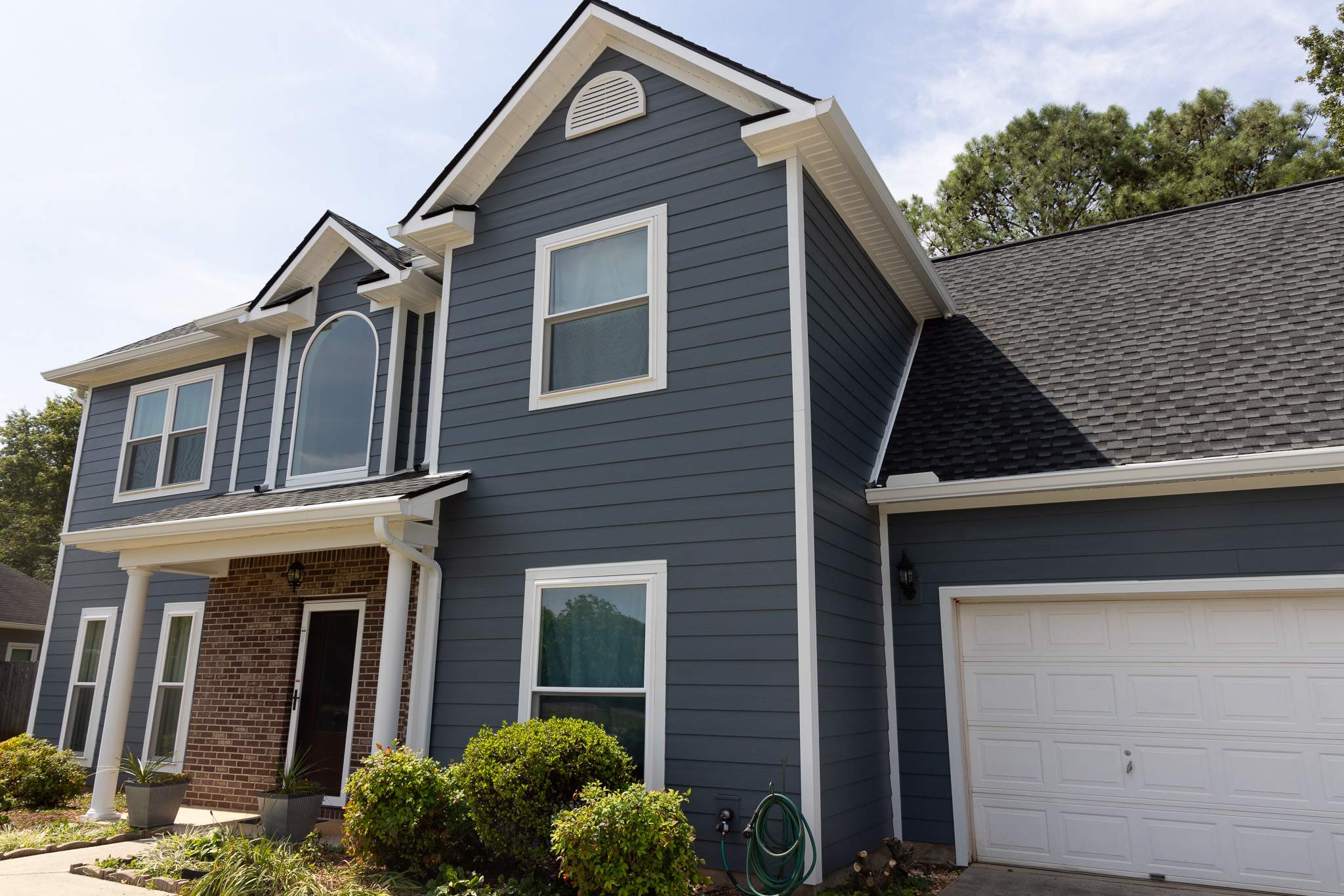 Evening Blue Hardie + Windows by Freedom Exteriors
