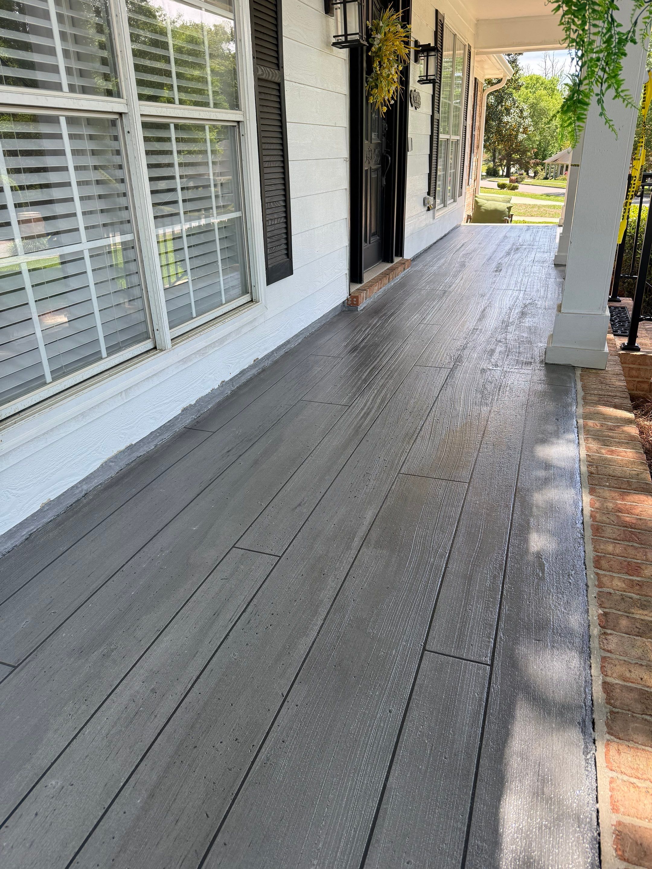 Wood-Grain Stenciled Concrete Porch Resurfacing in Mobile by Cornerstone Hard Surface Restoration 