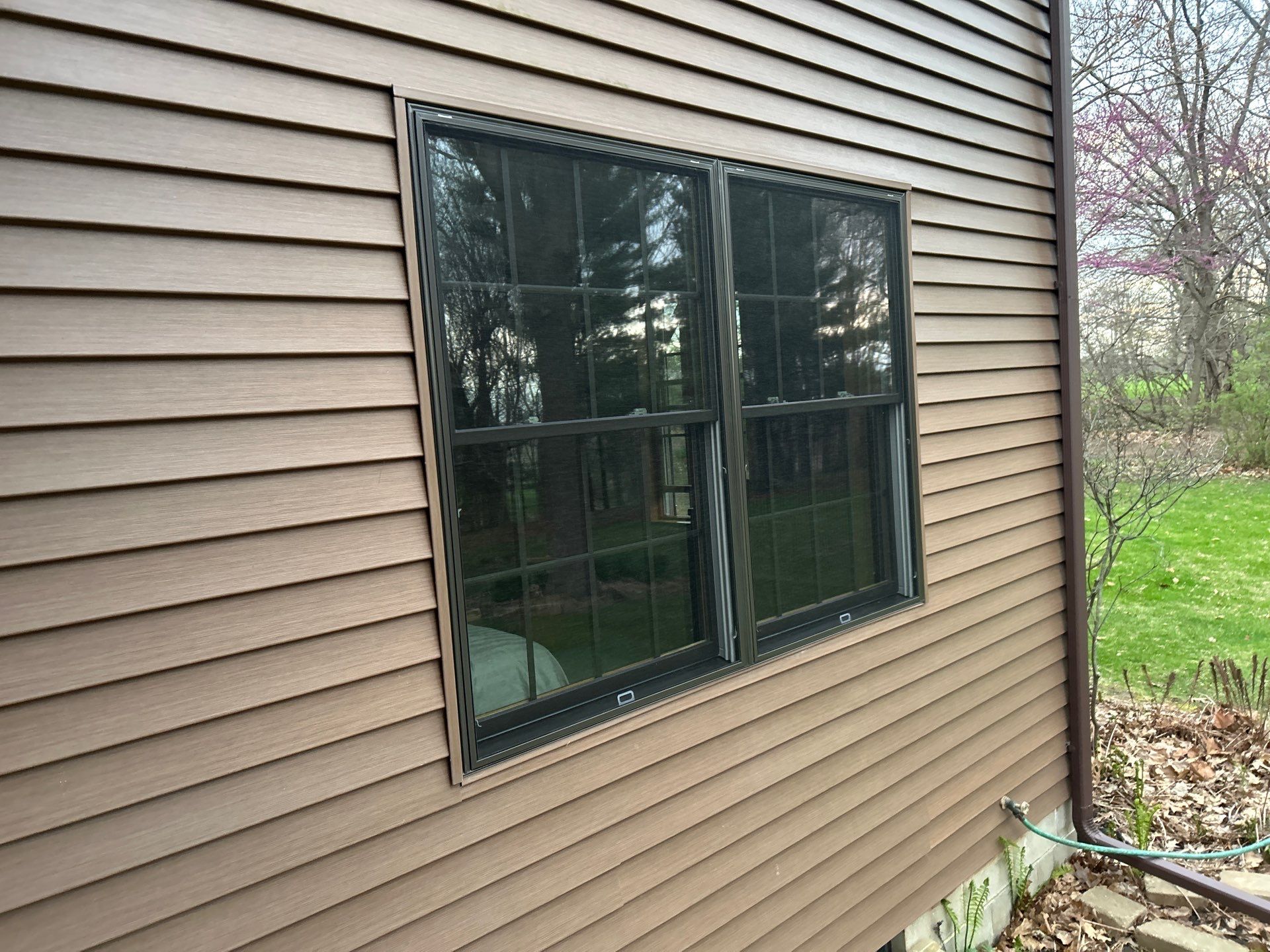 Pella Window installation using Pella Lifestyle wood/Aluminum window by United Windows and Siding LLC