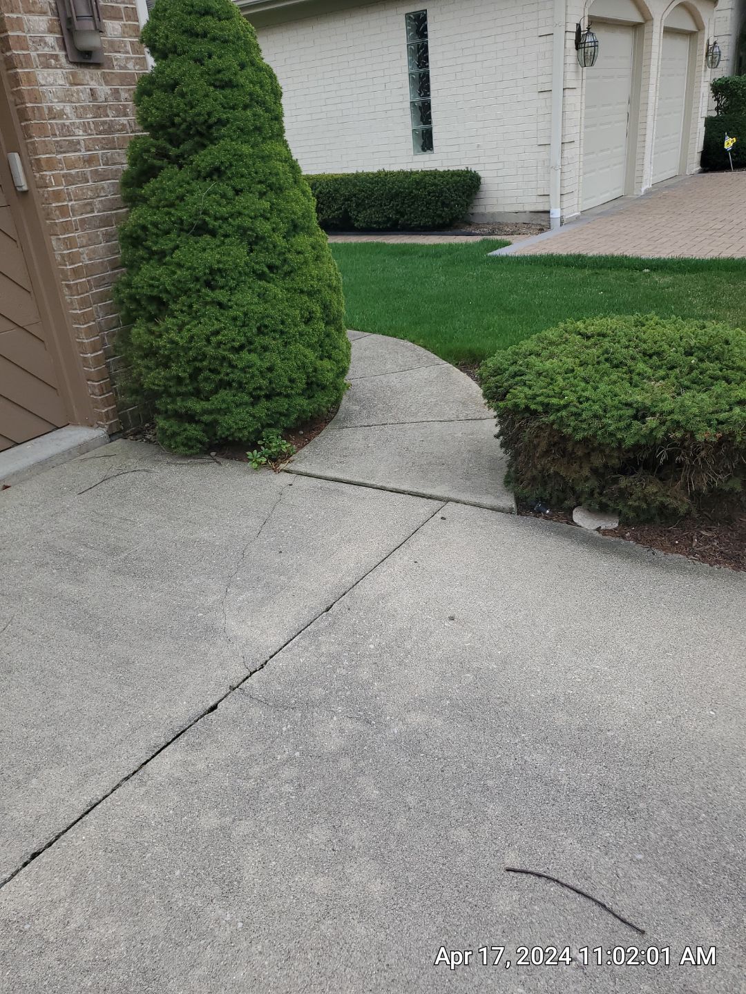 concrete patio and driveway cleaning by Northern Power Washing LLC.