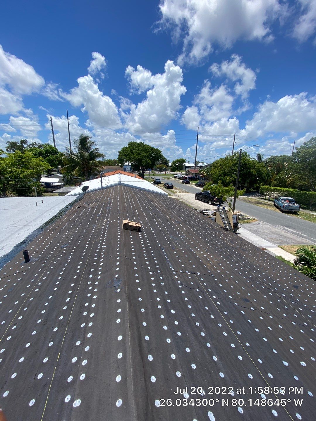 Standing Seam Metal & Flat Re-Roof using 1.5" Nail Strip 24ga Black Matte Kynar Coated Standing Seam Metal Panels by Morton Roofing, Inc.
