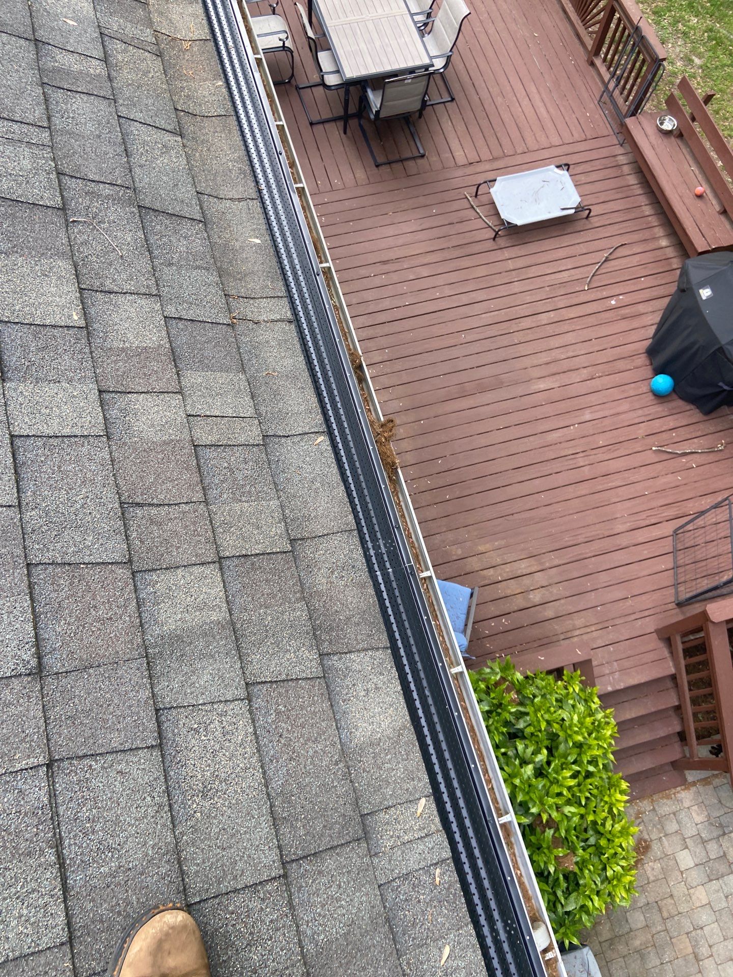 Gutter Installation using Black Gutter Guards  by Storm Ready Exteriors
