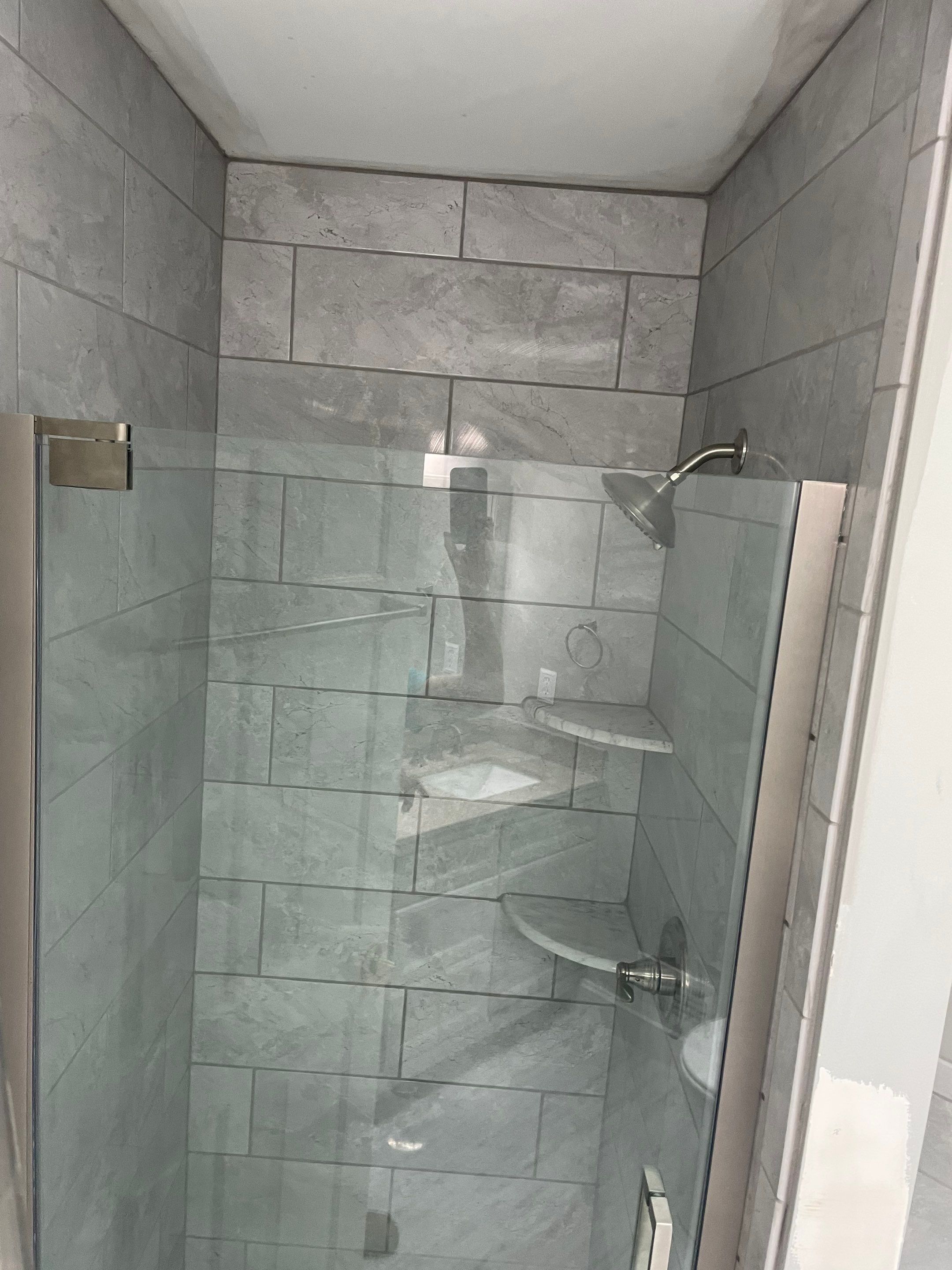 Bathroom Remodel using Tile by Home Concepts Construction