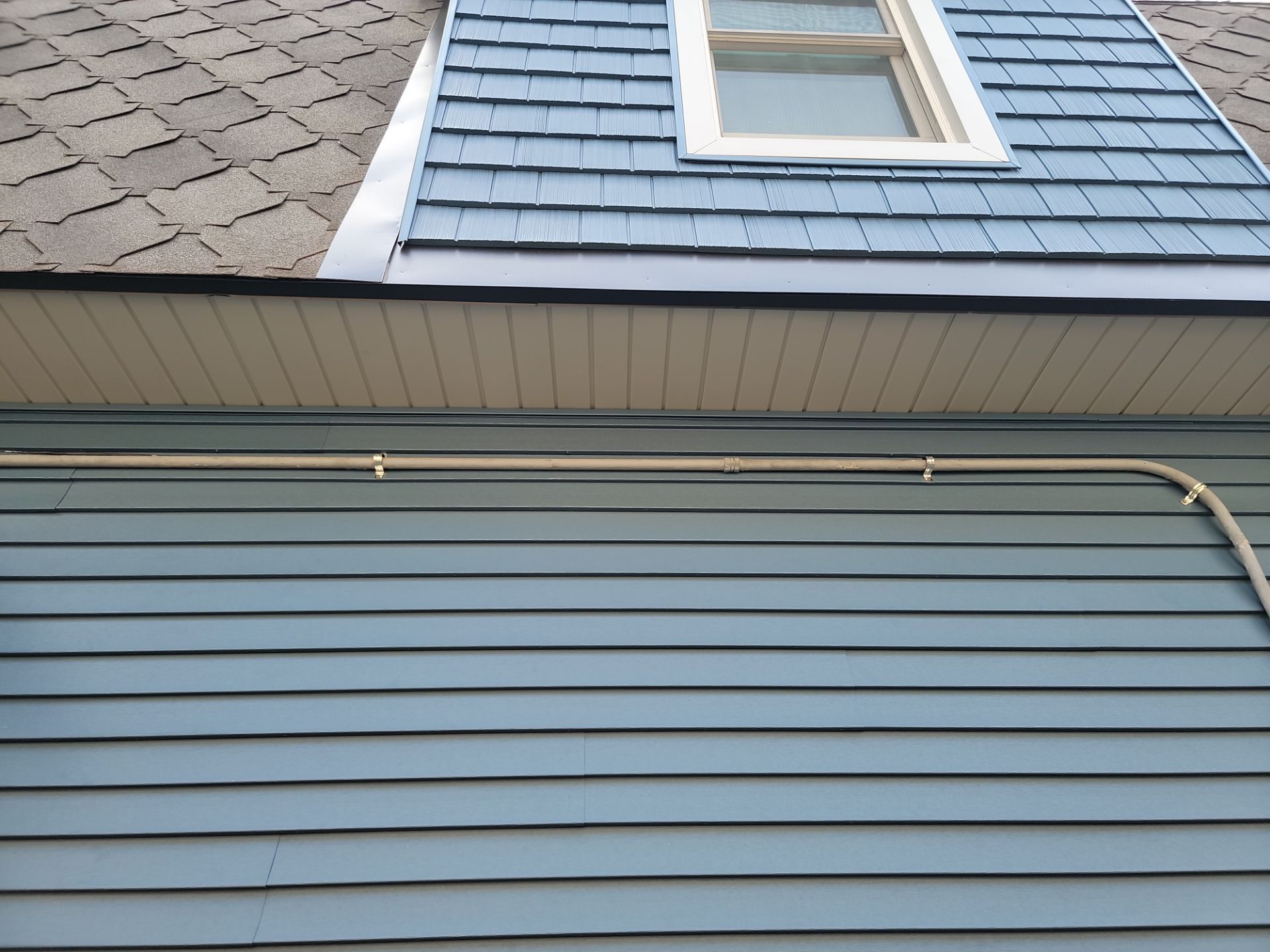 SIDING, DECK AND NEW PORCH  by Avalon Roofing and Exteriors