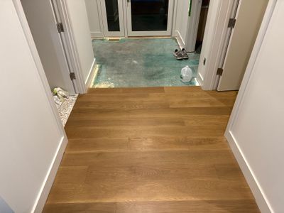 Custom Domestic White Oak Floors Installed in this Large Lakeshore Stunner!