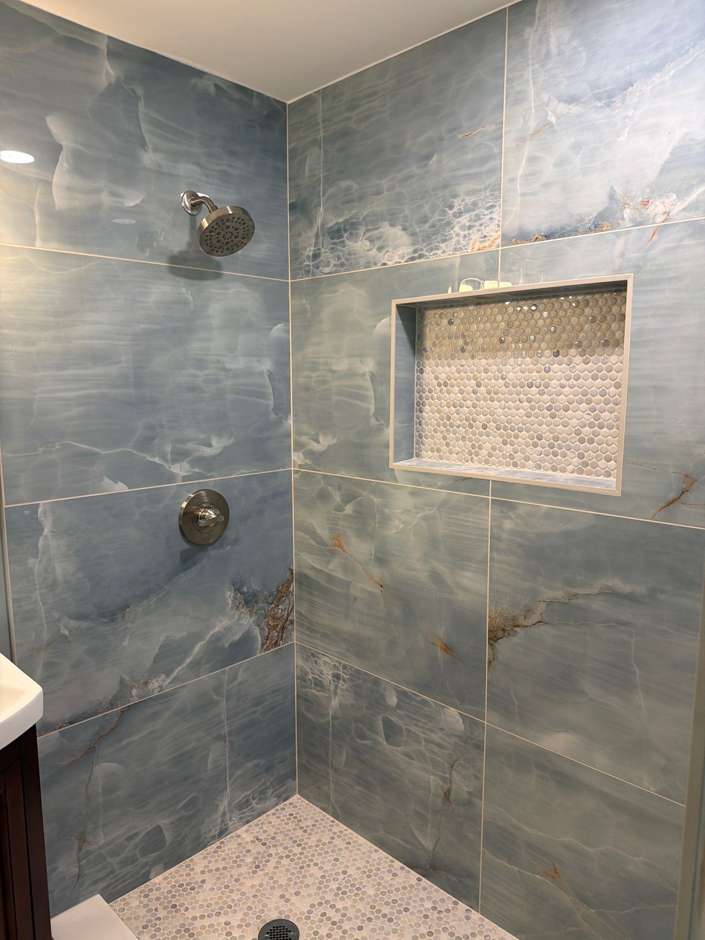 Elevated Bathroom Renovation featuring Oceanic Tile in Ormond Beach by Acies Renovations