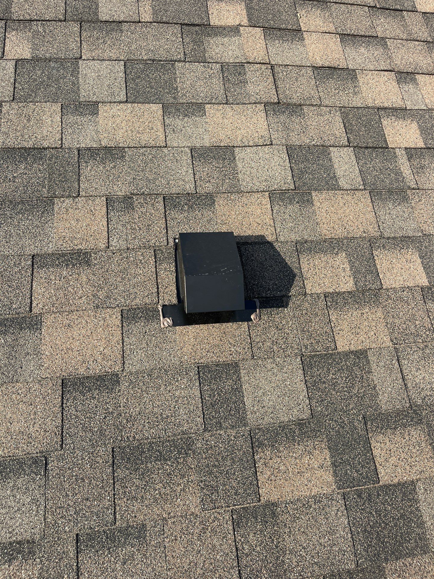 Tan exterior with IKO Driftshake by Tejas Roofworks + Restoration