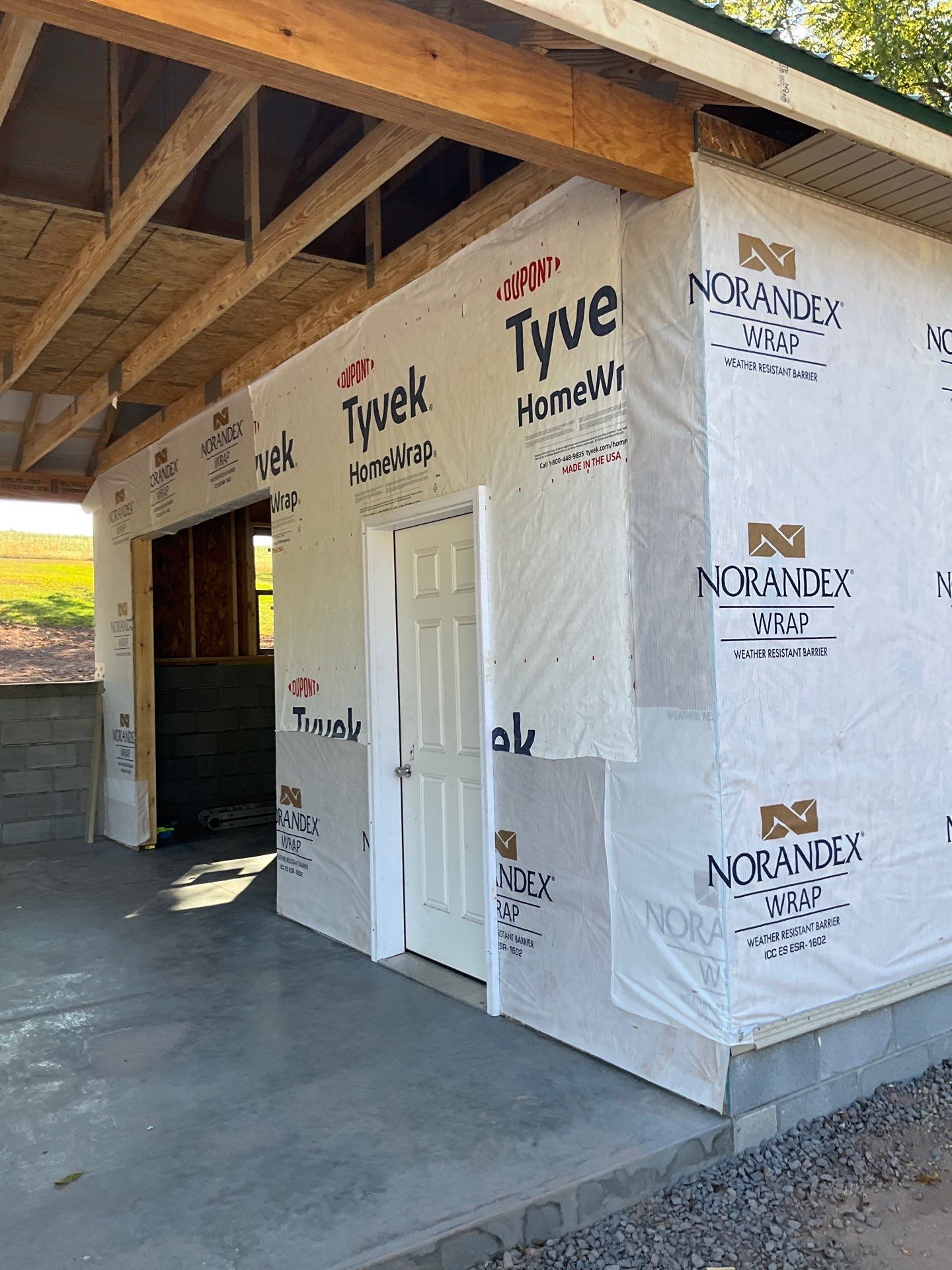 Detached Garage Construction with Vinyl Siding and Metal Roof by Esh Builders