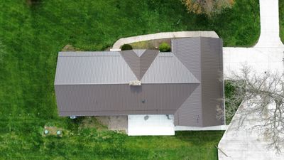 Residential Roofing Installation using Performance Panel Metal - Crinkle Bronze