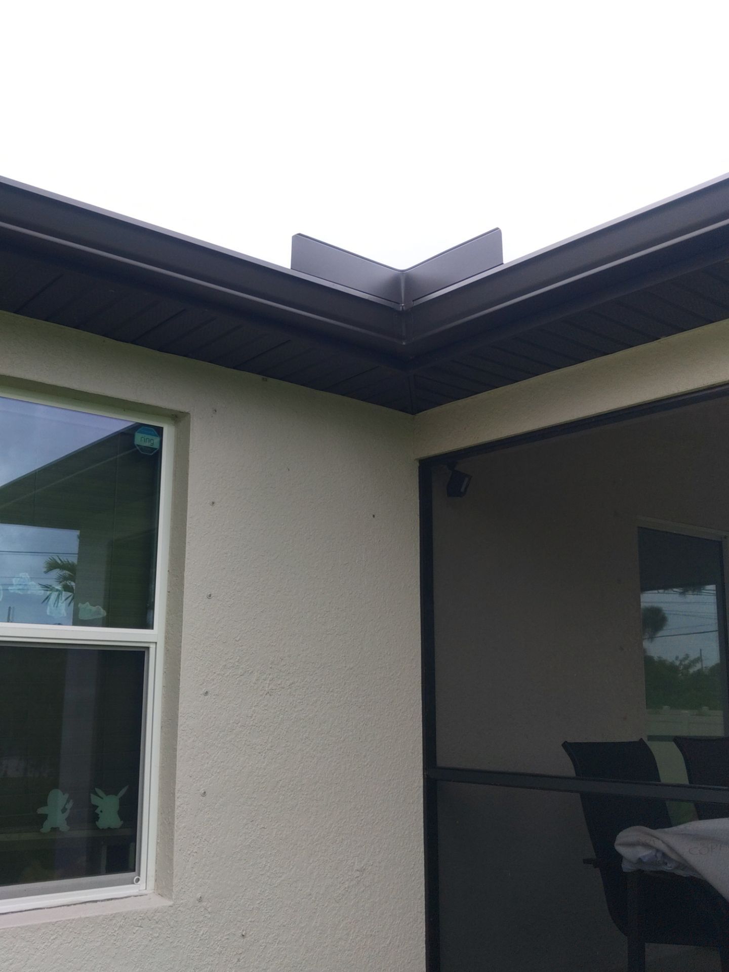 Black Seamless Gutters using black seamless gutters in Cape Coral FL by Gutter Professors