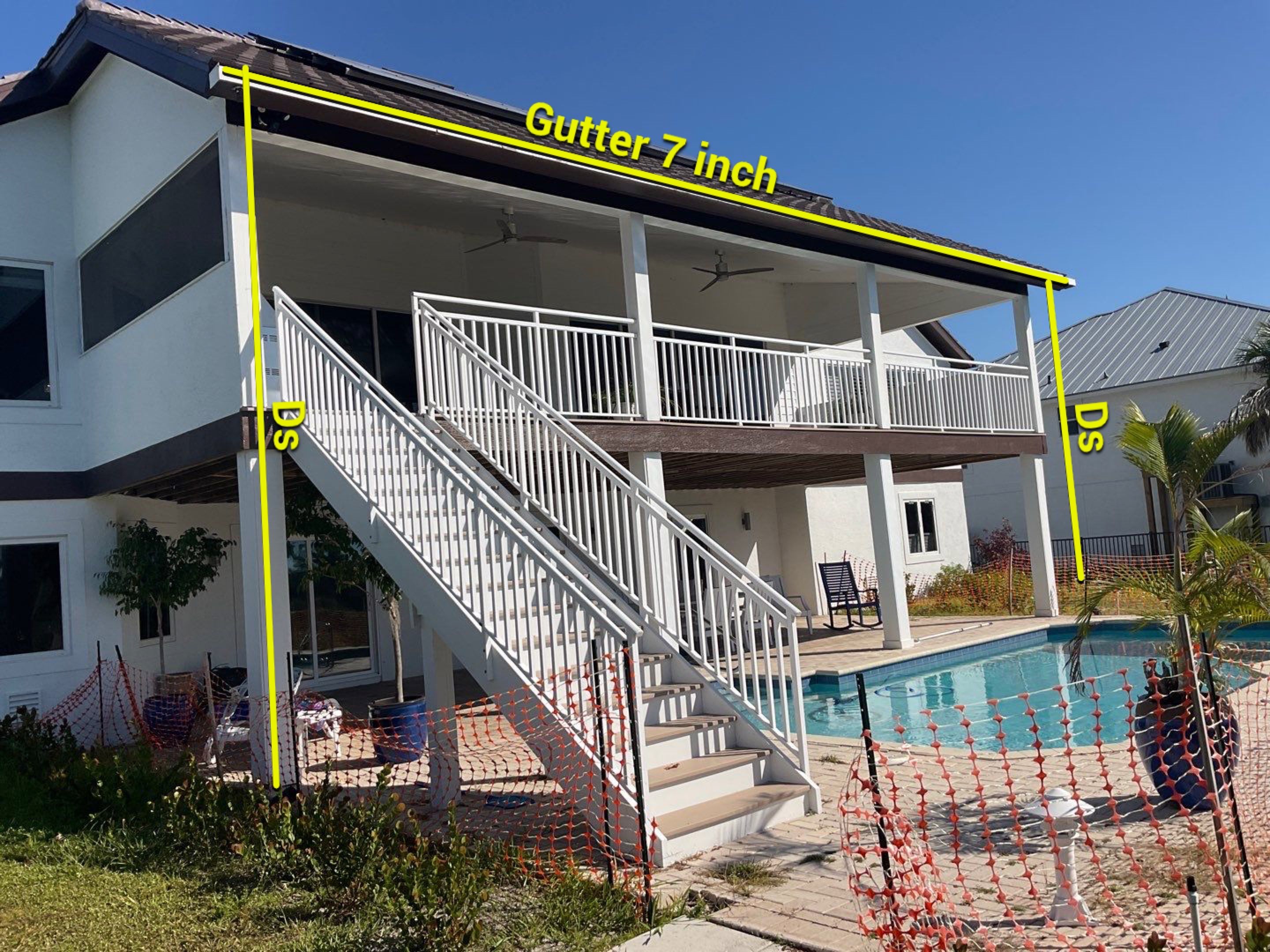 Musket Brown 7-Inch Gutters and White Down Spouts in Sanibel FL by Gutter Professors