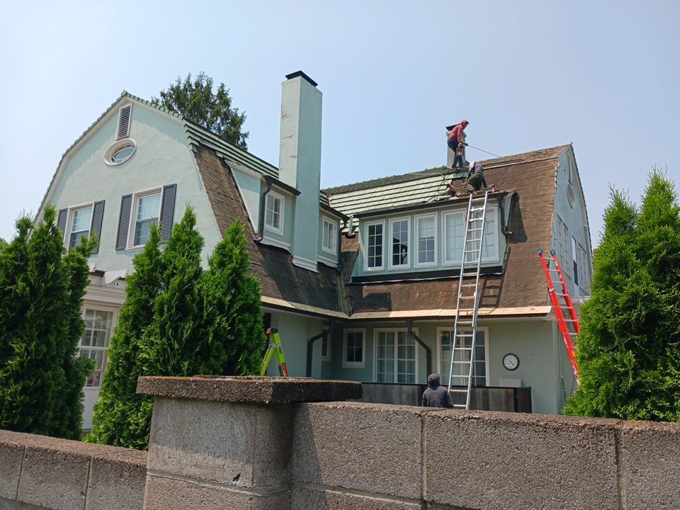 Slate removal/Cedar Shake replacement by Storm Contracting 