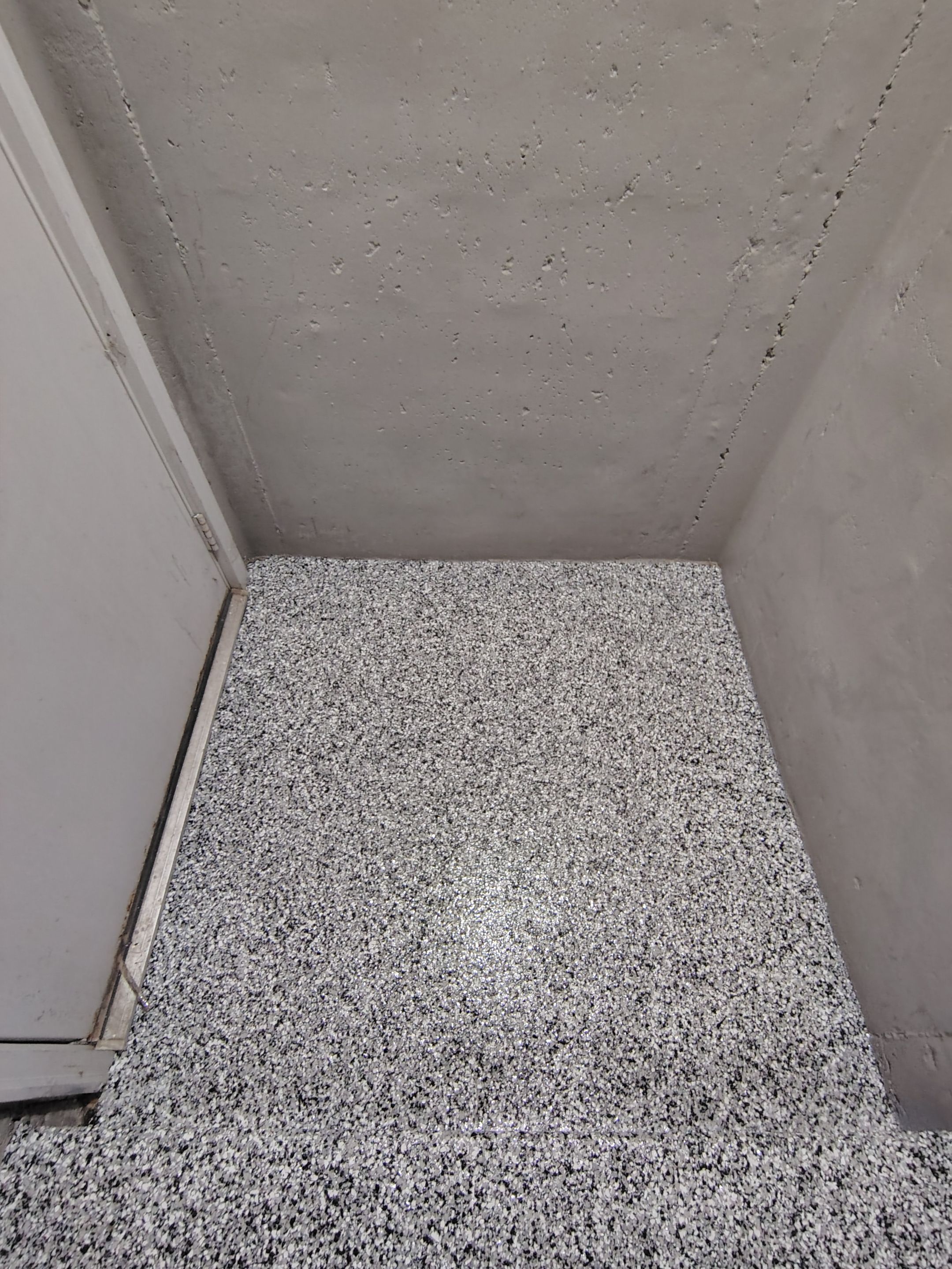 Garage Floor Concrete Coating and Crack Repair in Sioux Falls by Select Painting, Coatings & Garage Cabinets