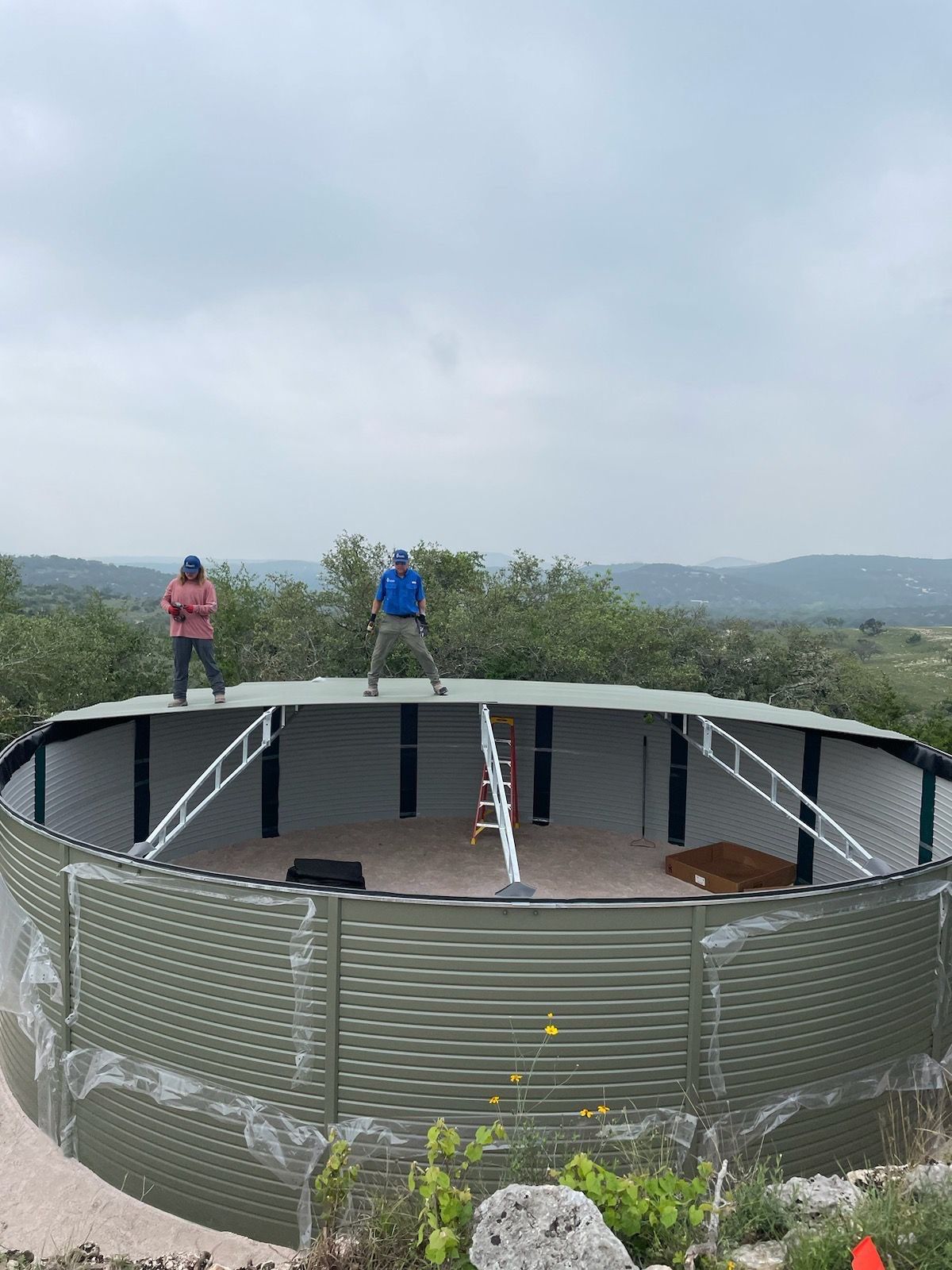 Residential Rainwater Collection System - Pioneer 40K gallon water tank in Mangrove Green by Hill Country Rain Water