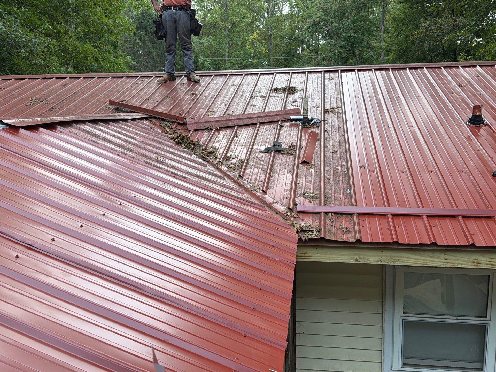 Red Metal Roof Restoration and Wood Fascia Replacement in Barboursville by Cade Construction