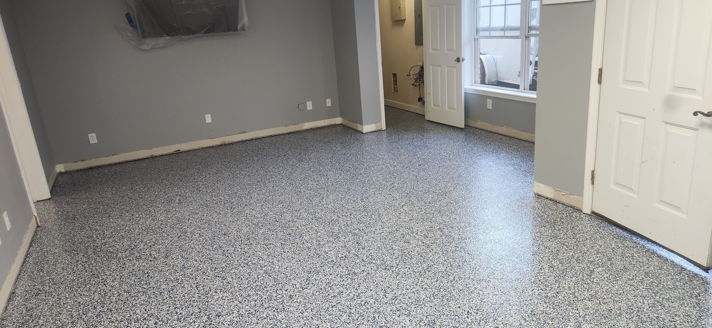 Basement using Denim by Elite Floor Solutions
