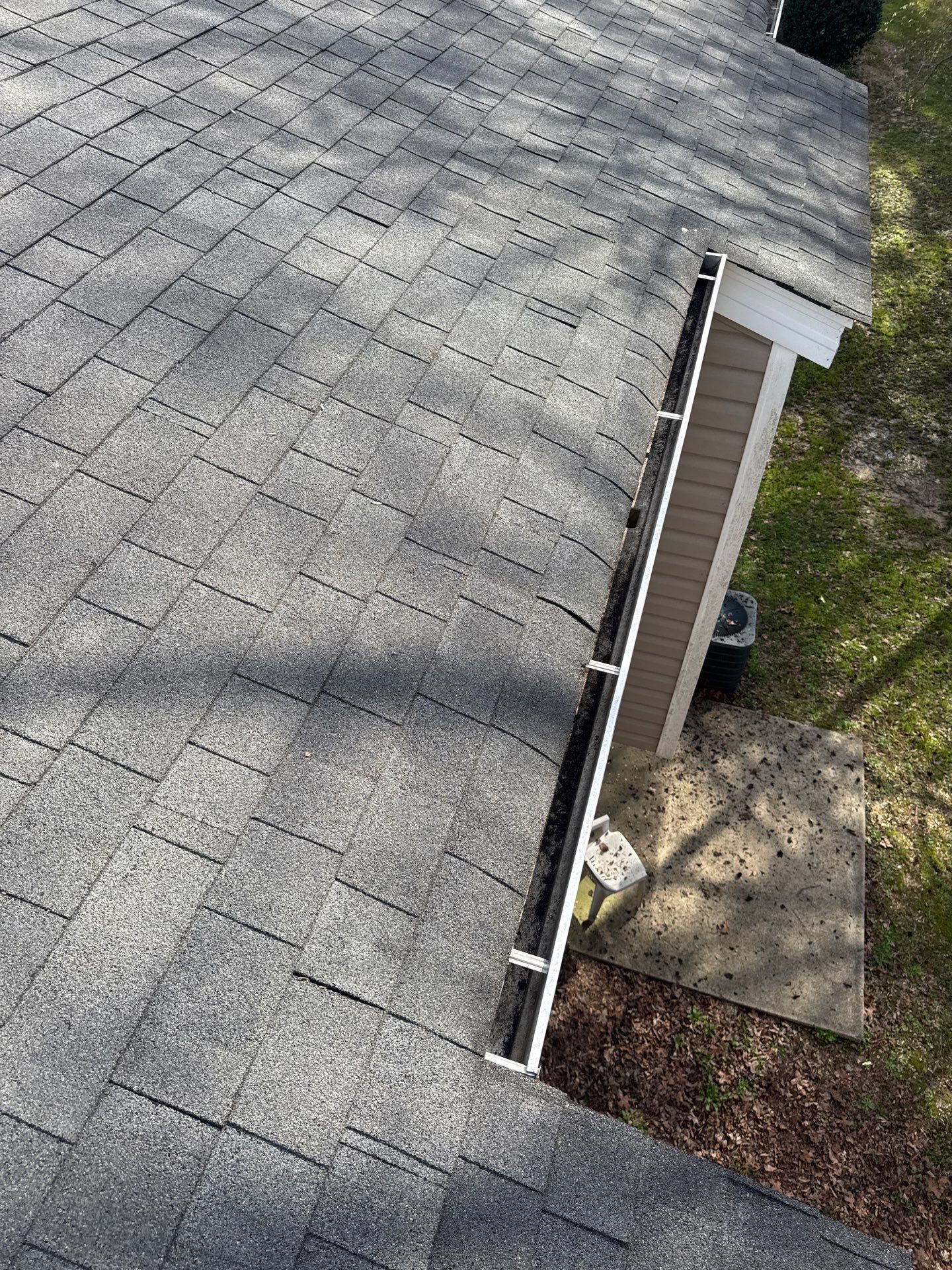HOA gutter cleaning in Pinehurst & Southern Pines, NC, after  photo showing full gutters.