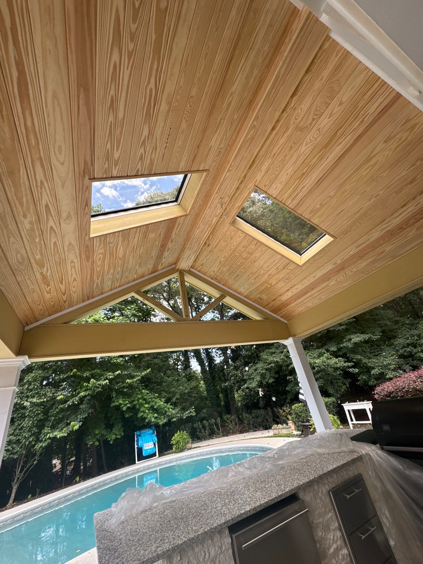 Marietta Poolside Pavilion with Custom Outdoor Kitchen and Pergola by Swift Home Renovations