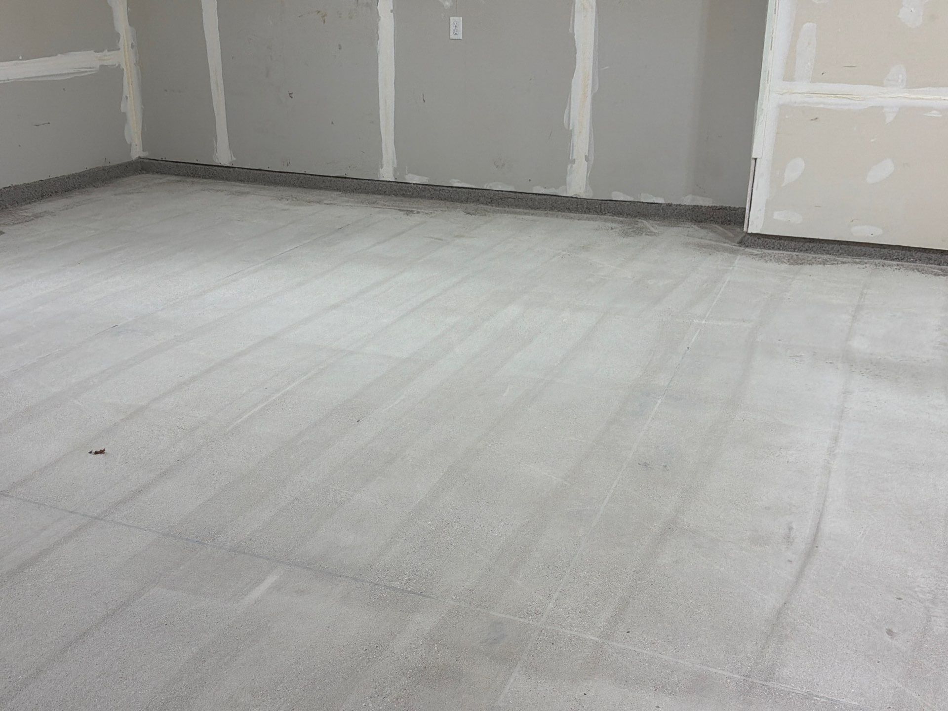 Hudsonville Garage Renovation Featuring Finished Drywall and Flake Epoxy Floors by Gordon Painting