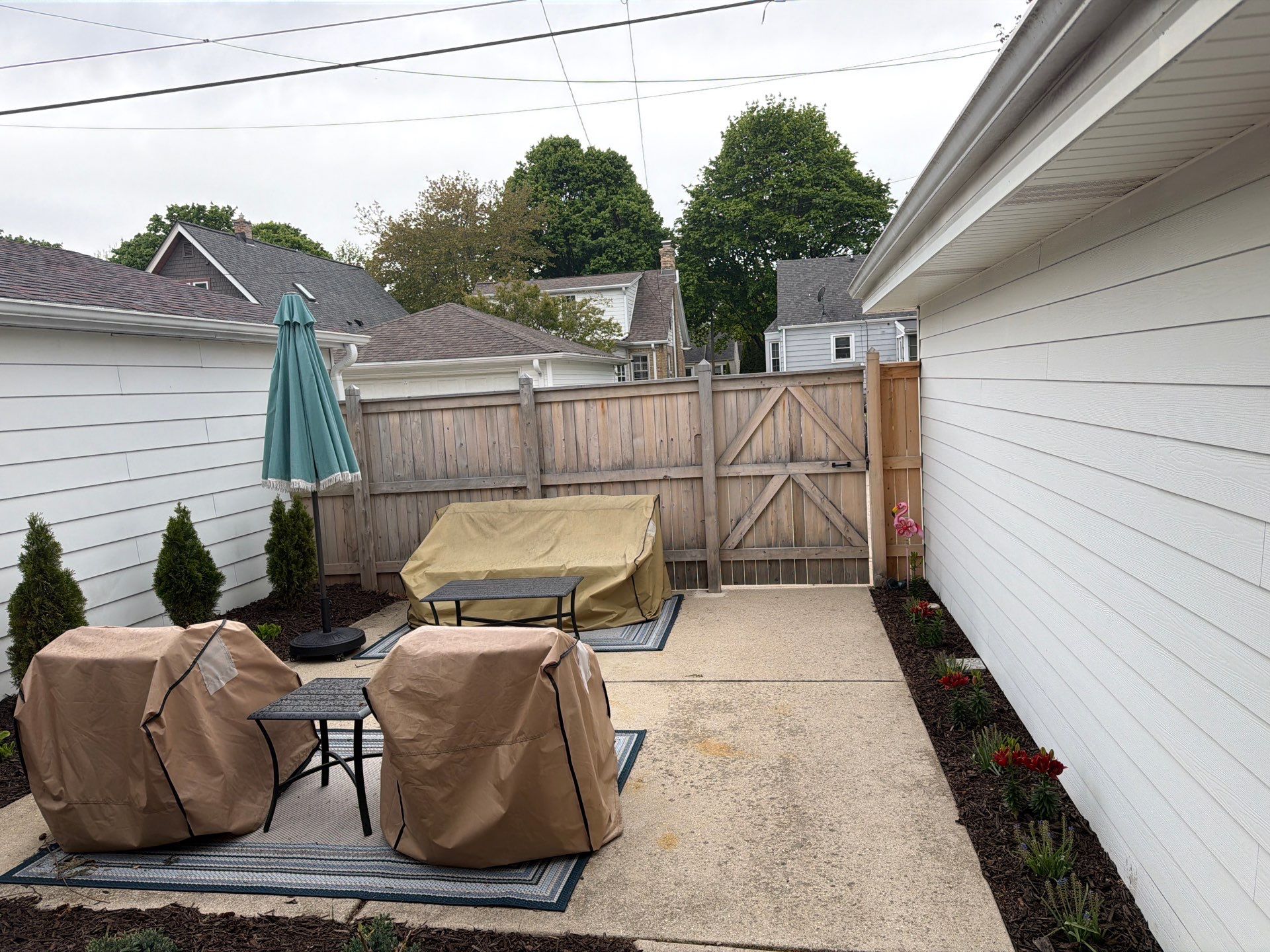 Milwaukee Wood Privacy Fence Installation and Concrete Patio Upgrade by OCS Contracting Services