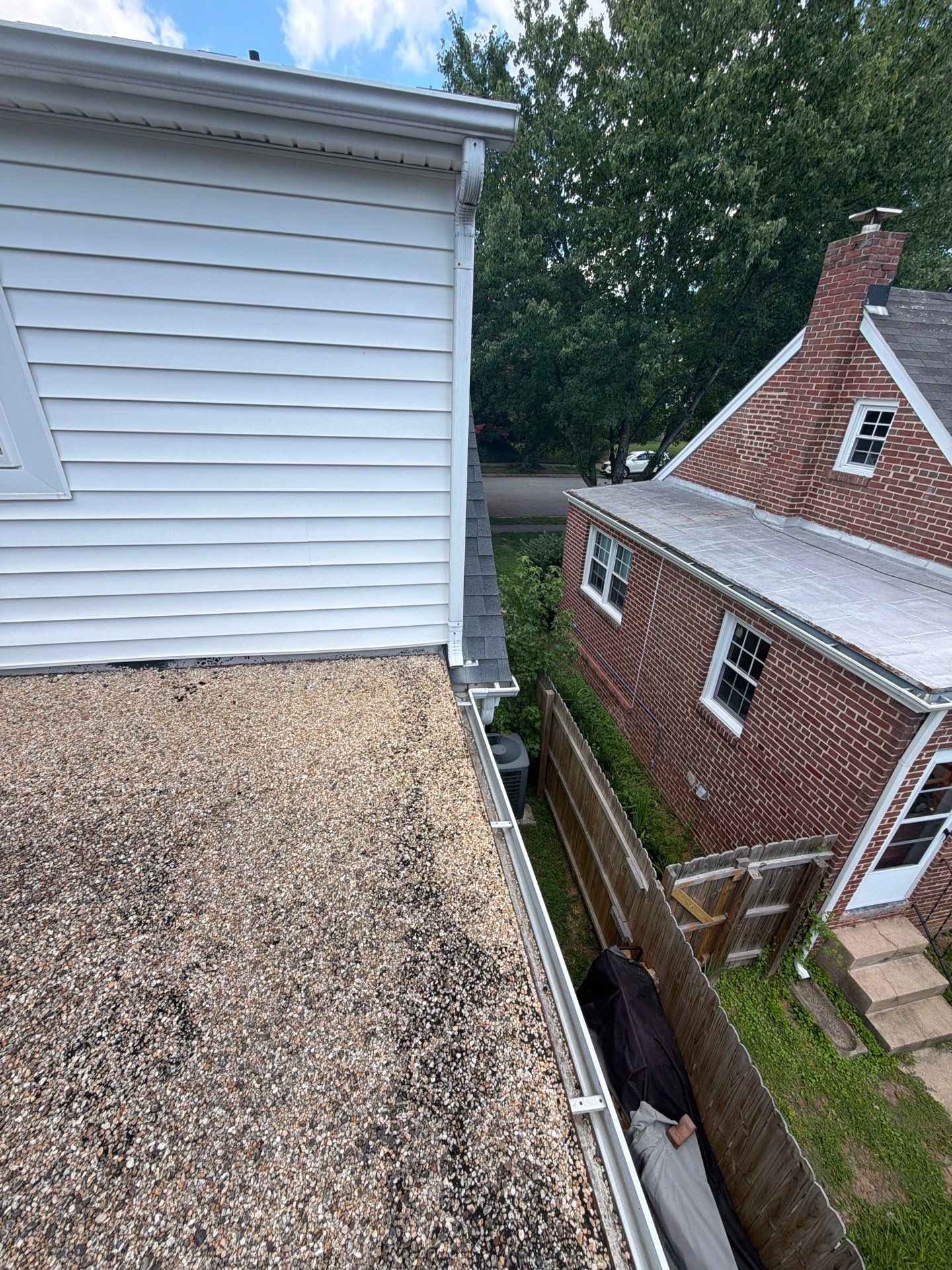 Richmond Roof Replacement Including Flat Membrane and Asphalt Shingles by Cade Construction