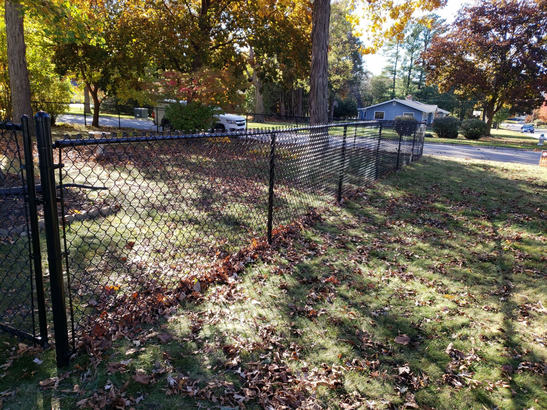 Black Chain Link Fence Installation in Cedar Falls, Iowa by Perfect Picket Fence and Stain