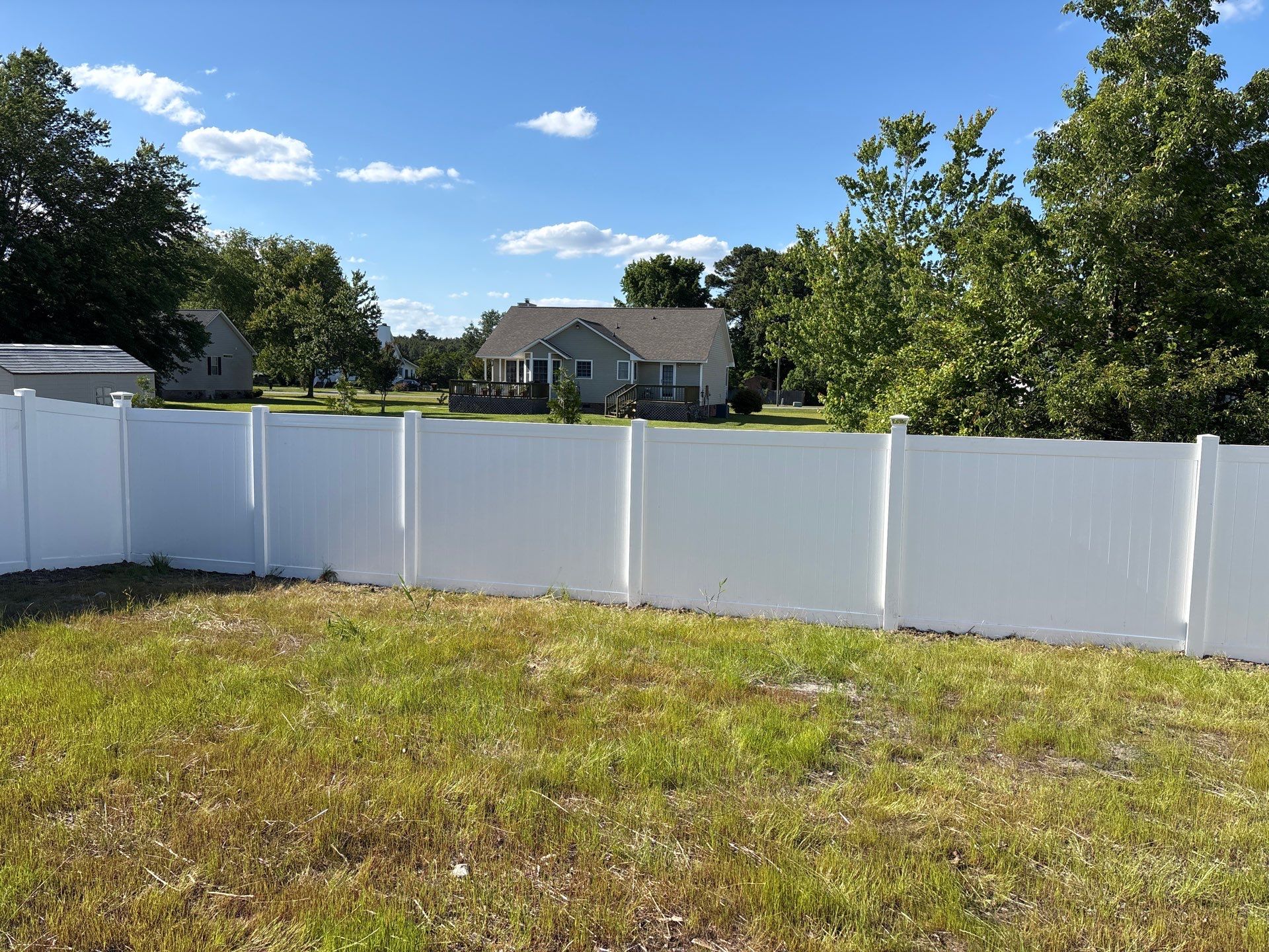 White Hamilton Vinyl Privacy Fence and Double Gate Installation in Greenville by Superior Fence and Rail