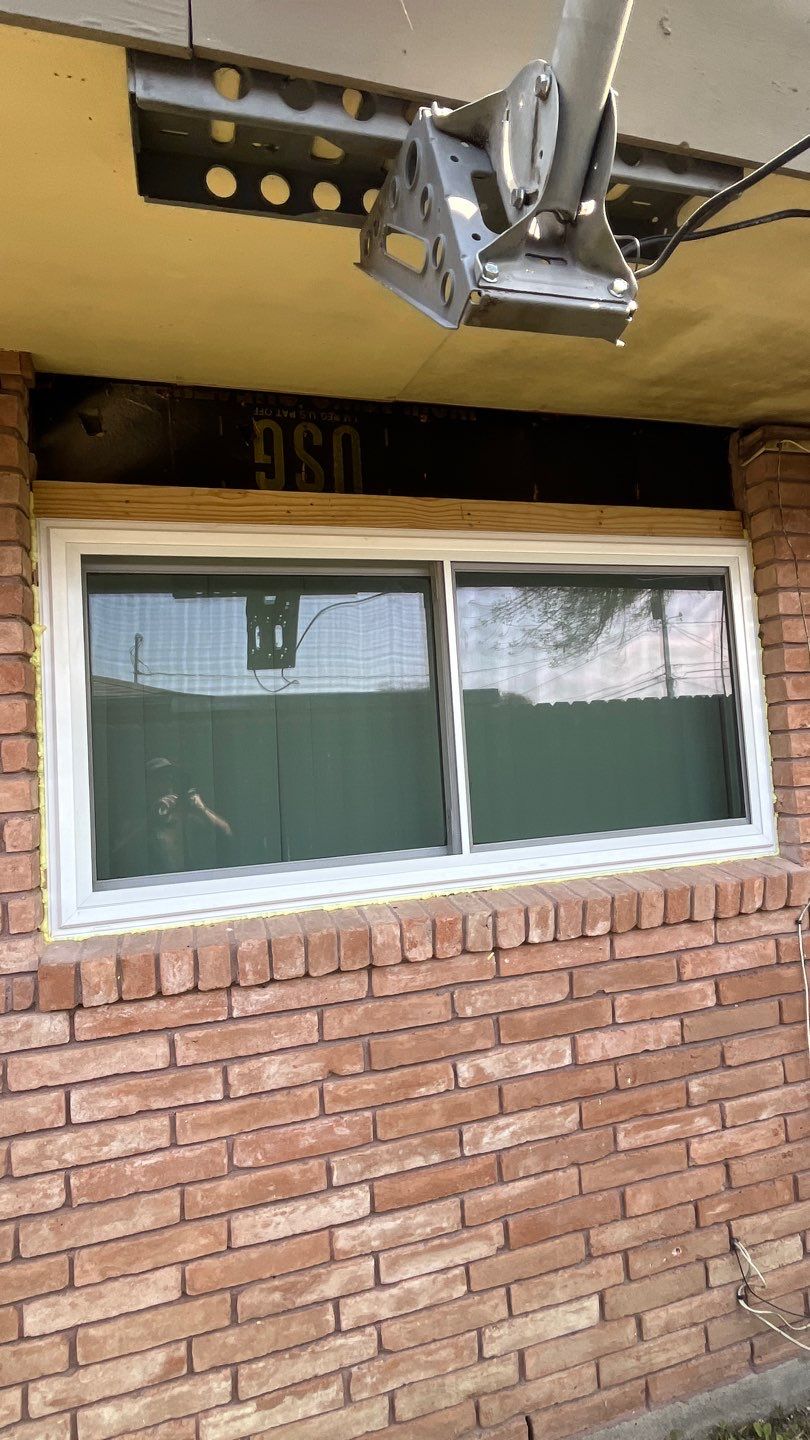 Windows in Brick with a Bay Window by Bayfront Roofing and Construction
