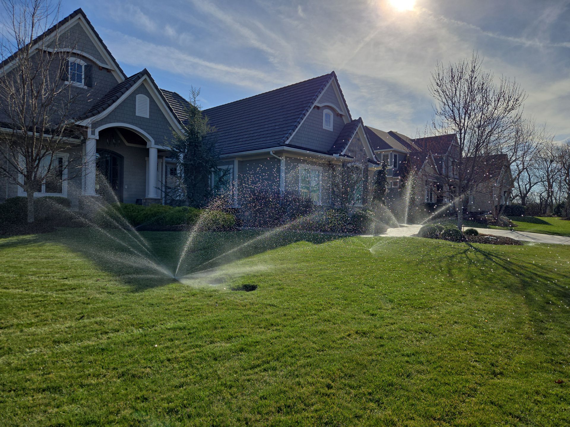 Front Yard Landscape and Walkway Renovation in Overland Park by LAND ESCAPES LLC