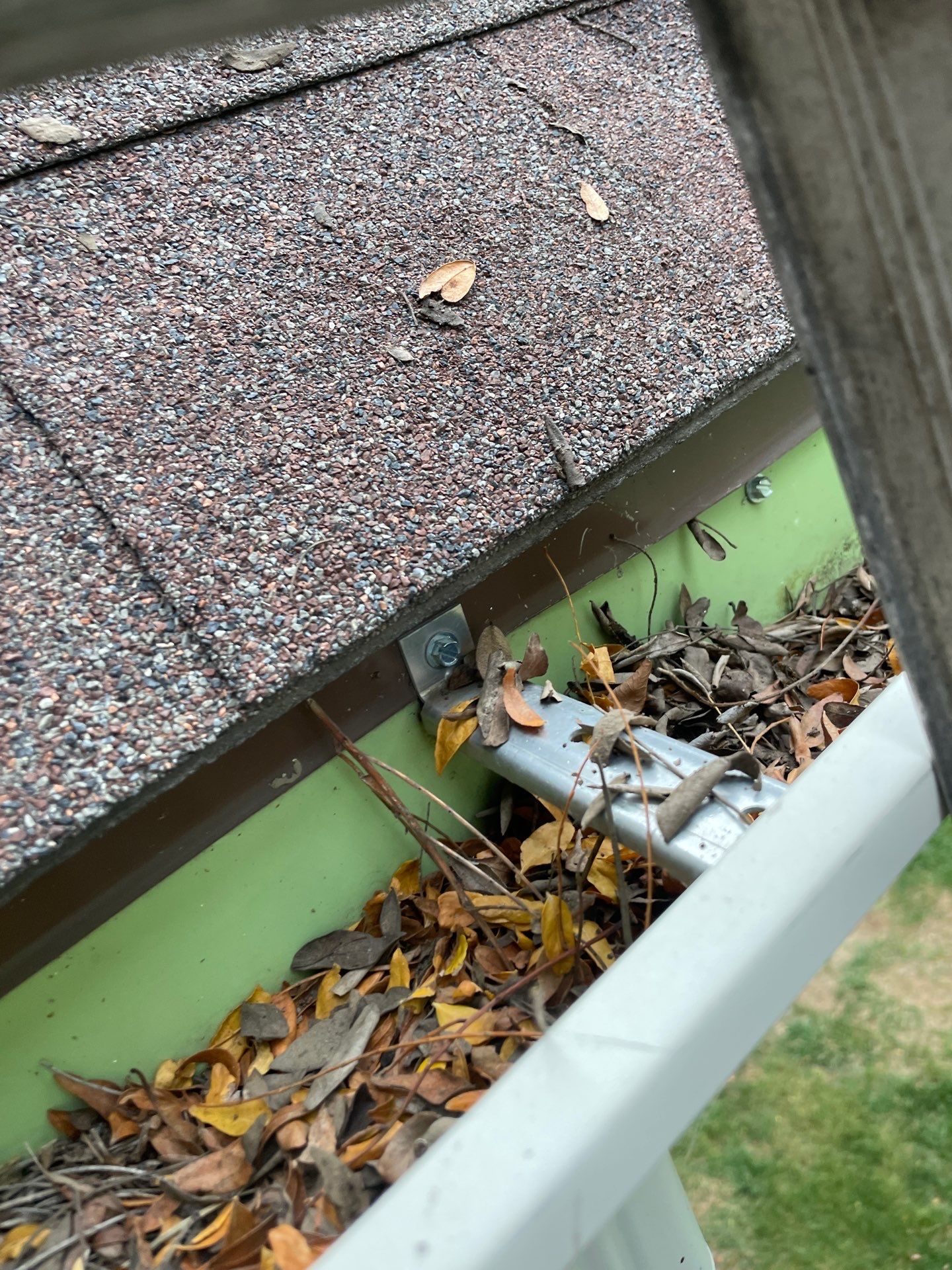 Commercial gutter cleaning Omaha before photo with filled gutters