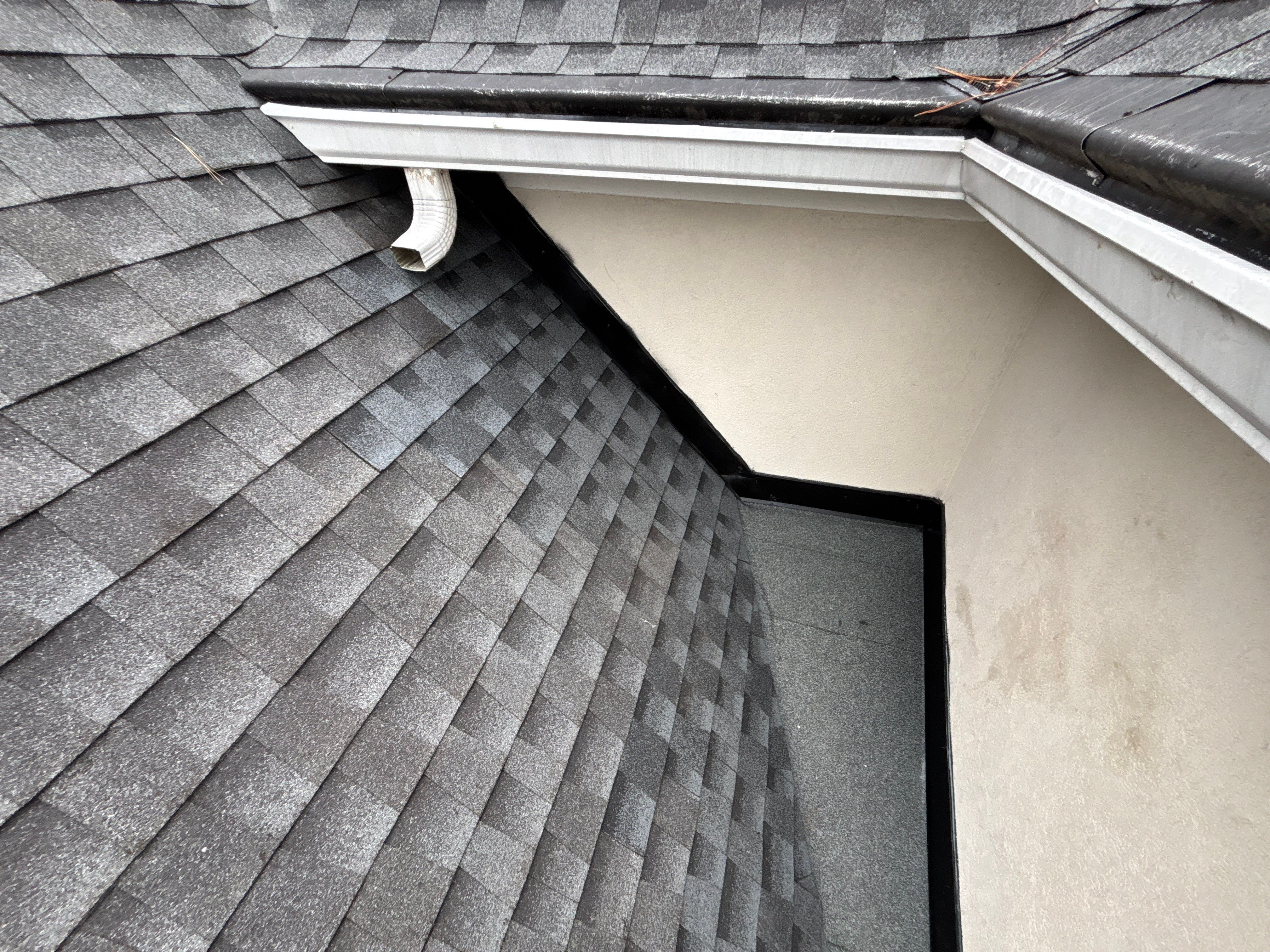 Wrong V valley section installed  by Deerfield Roofing LLC