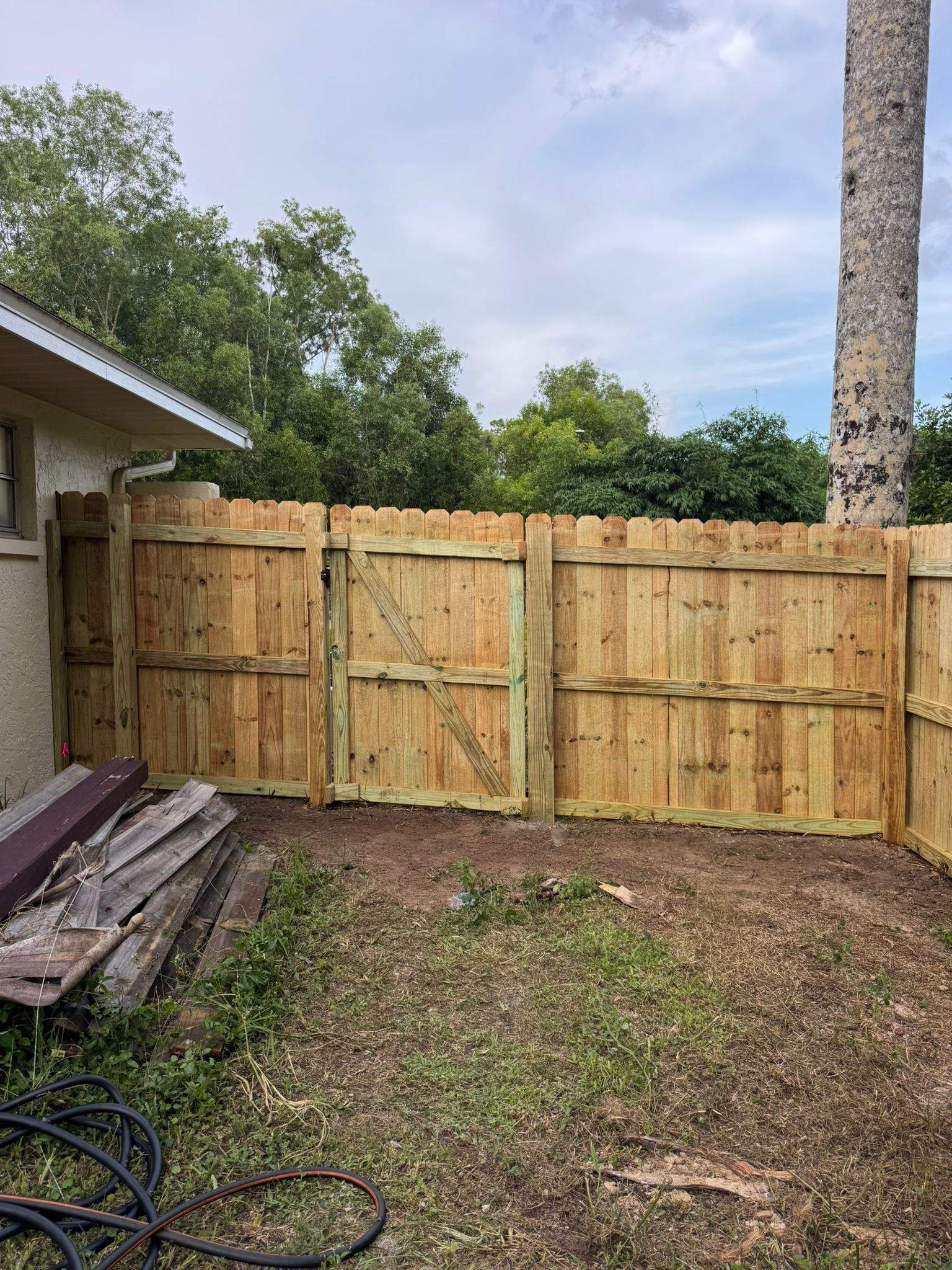 Pressure-Treated Wood Privacy Fence with Dog-Ear Pickets in Lehigh Acres by True Fence LLC