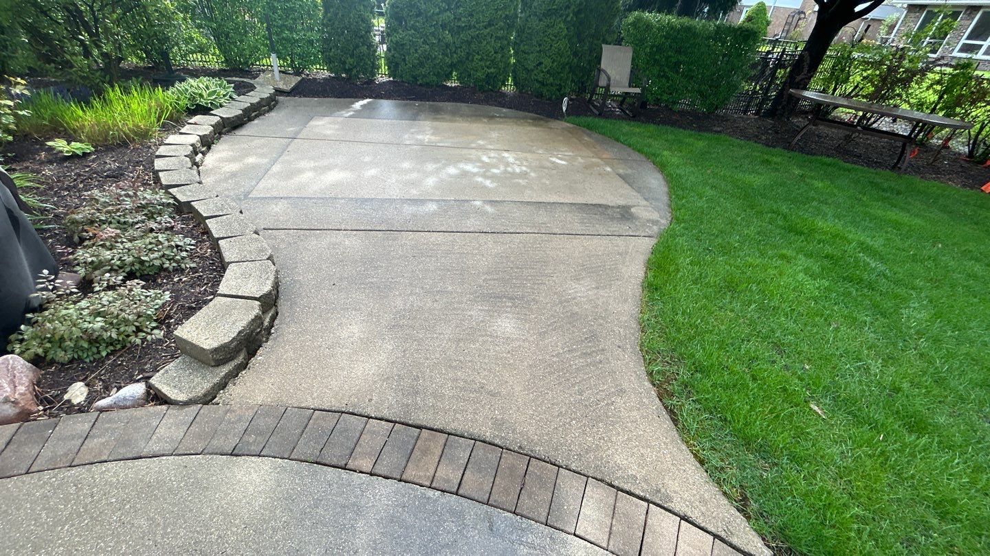 concrete patio and driveway cleaning by Northern Power Washing LLC.