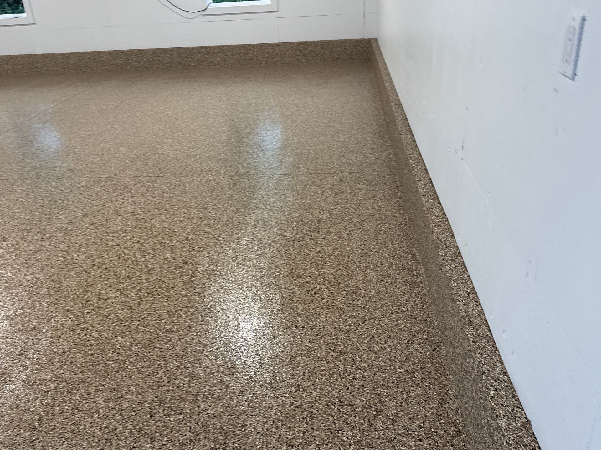 Garage in Gainesville, FL in Sandstone by Cross Creek Concrete Coatings