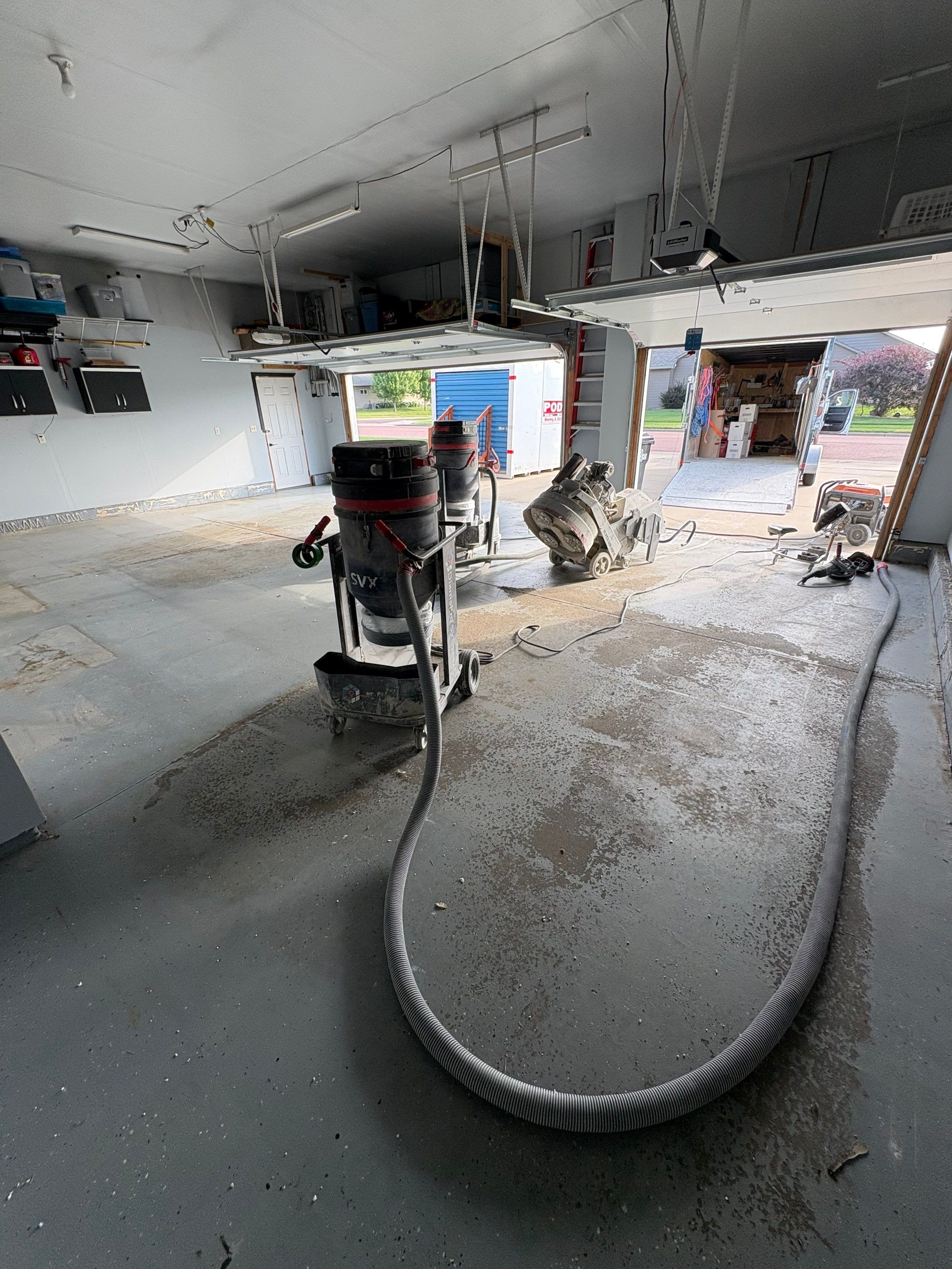 Sioux Falls Garage Concrete Coating Installation with Domino Flake by Select Painting, Coatings & Garage Cabinets