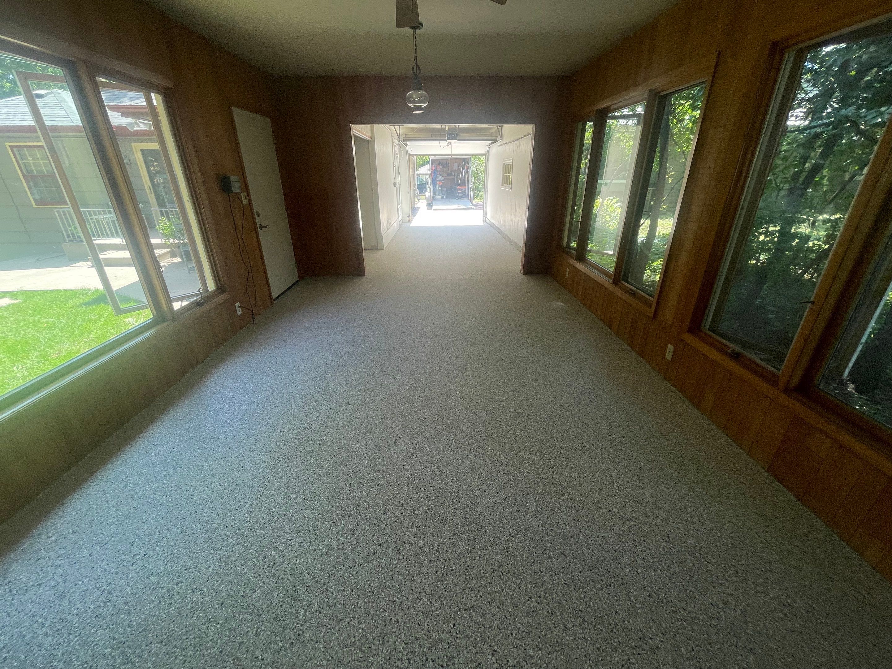 Sioux Falls Garage and Sunroom Concrete Coating with Coyote Flake by Select Painting, Coatings & Garage Cabinets