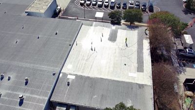 Aerial view of a large commercial metal roof project