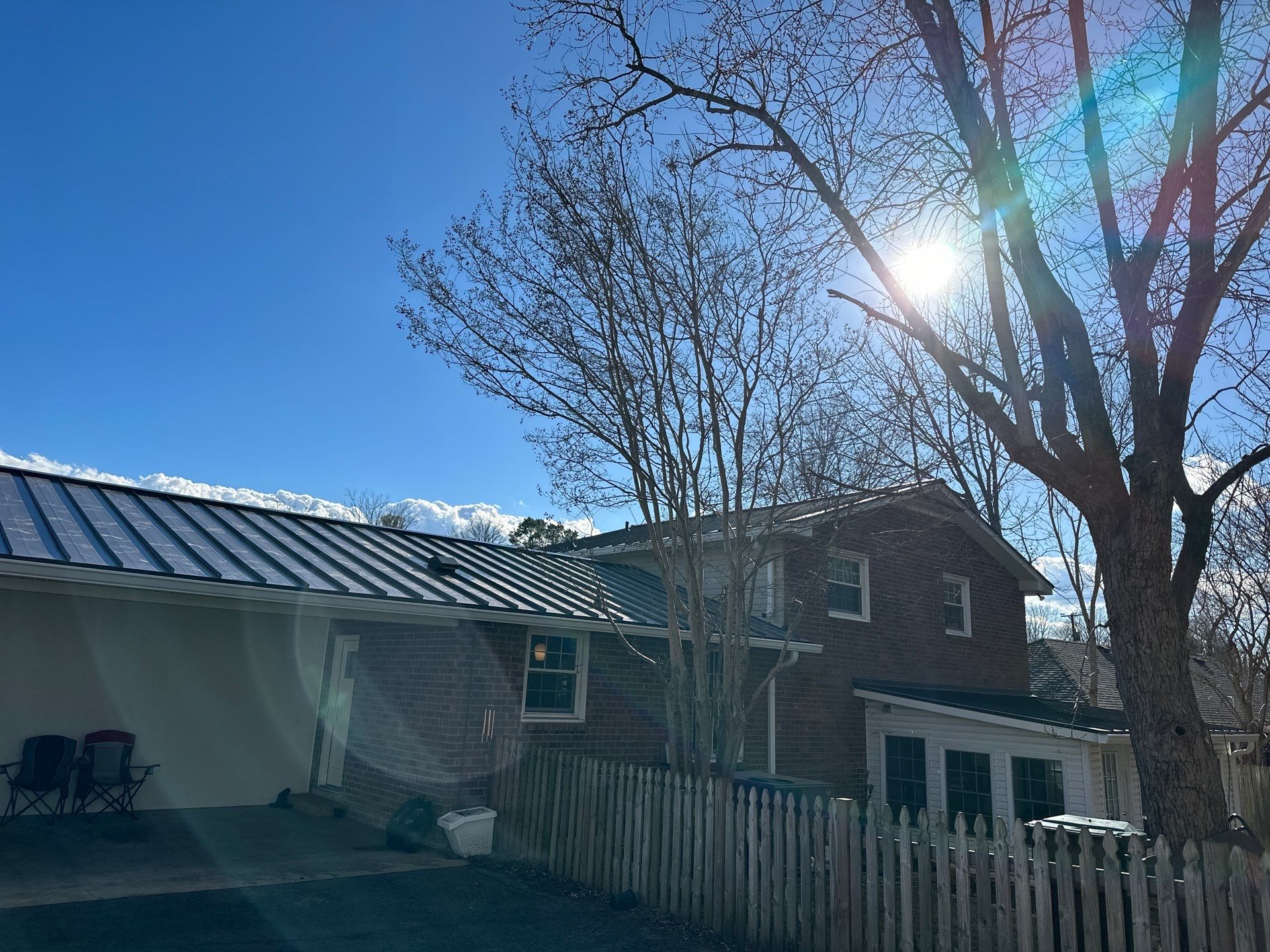 Residential Roofing Installation using Standing Seam Metal by Undersun Roofing 