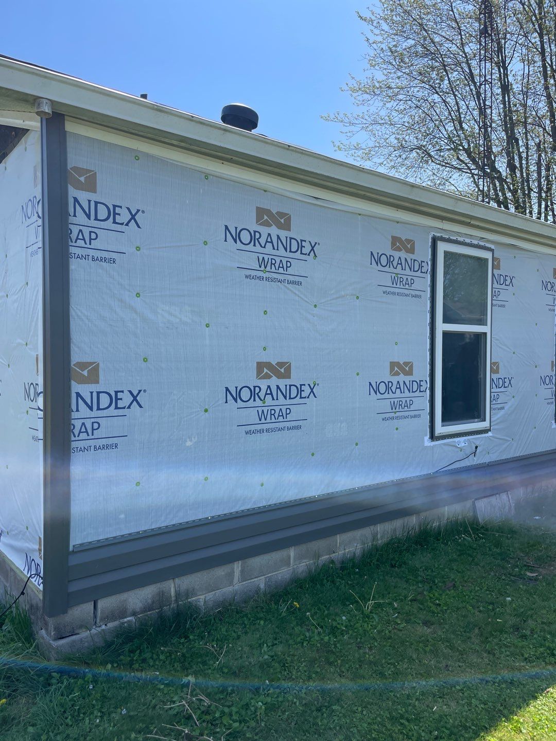 Roof and Siding Replacement using Norandex Cedar Knoll Graphite Siding and Owens Corning Durations in Onyx Black by WIW Enterprises Inc