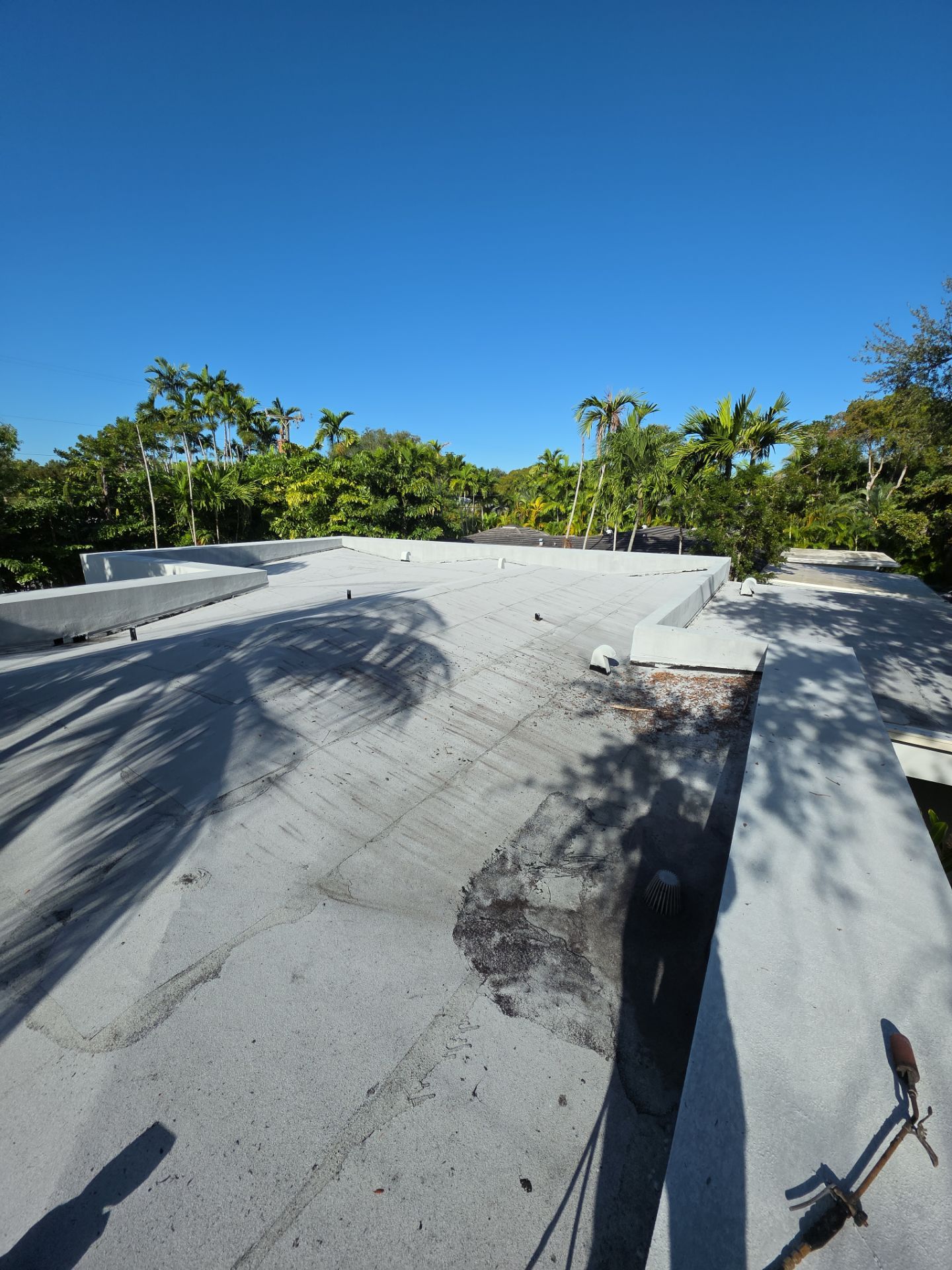 Flat Roof Silicone Coating and Interior Water Damage Restoration in Miami by Picos Construction Engineering