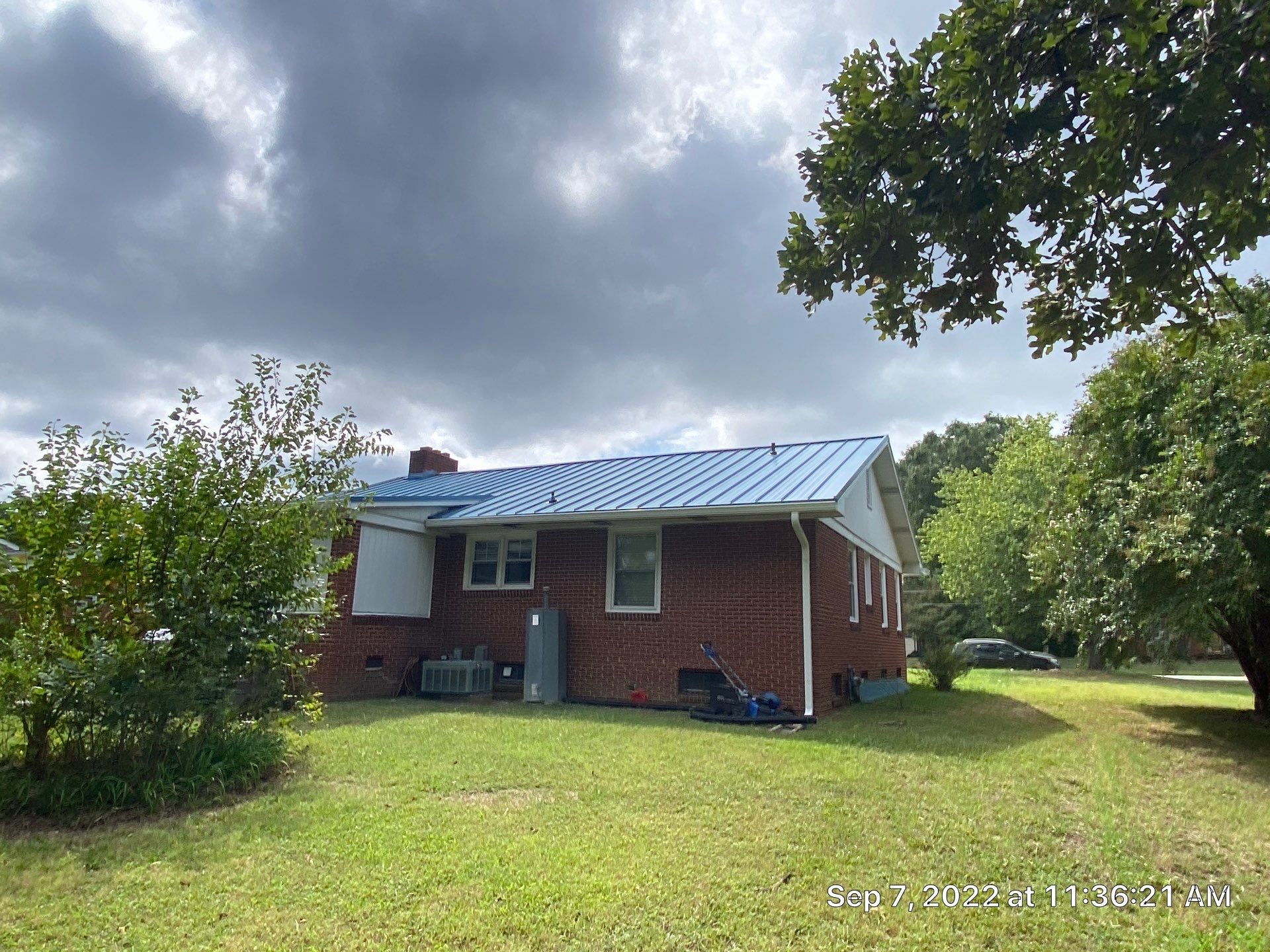 Carolina Blue Standing Seam Roof by Just In Time Roofing and Restoration