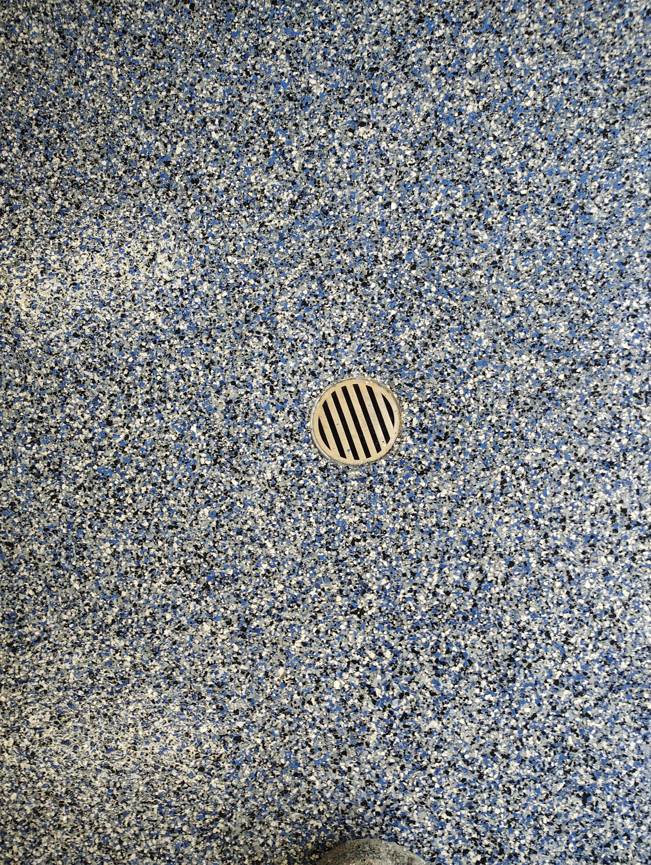Custom Grey Flake Epoxy Garage Floor Installation in Remsen by Select Painting, Coatings & Garage Cabinets