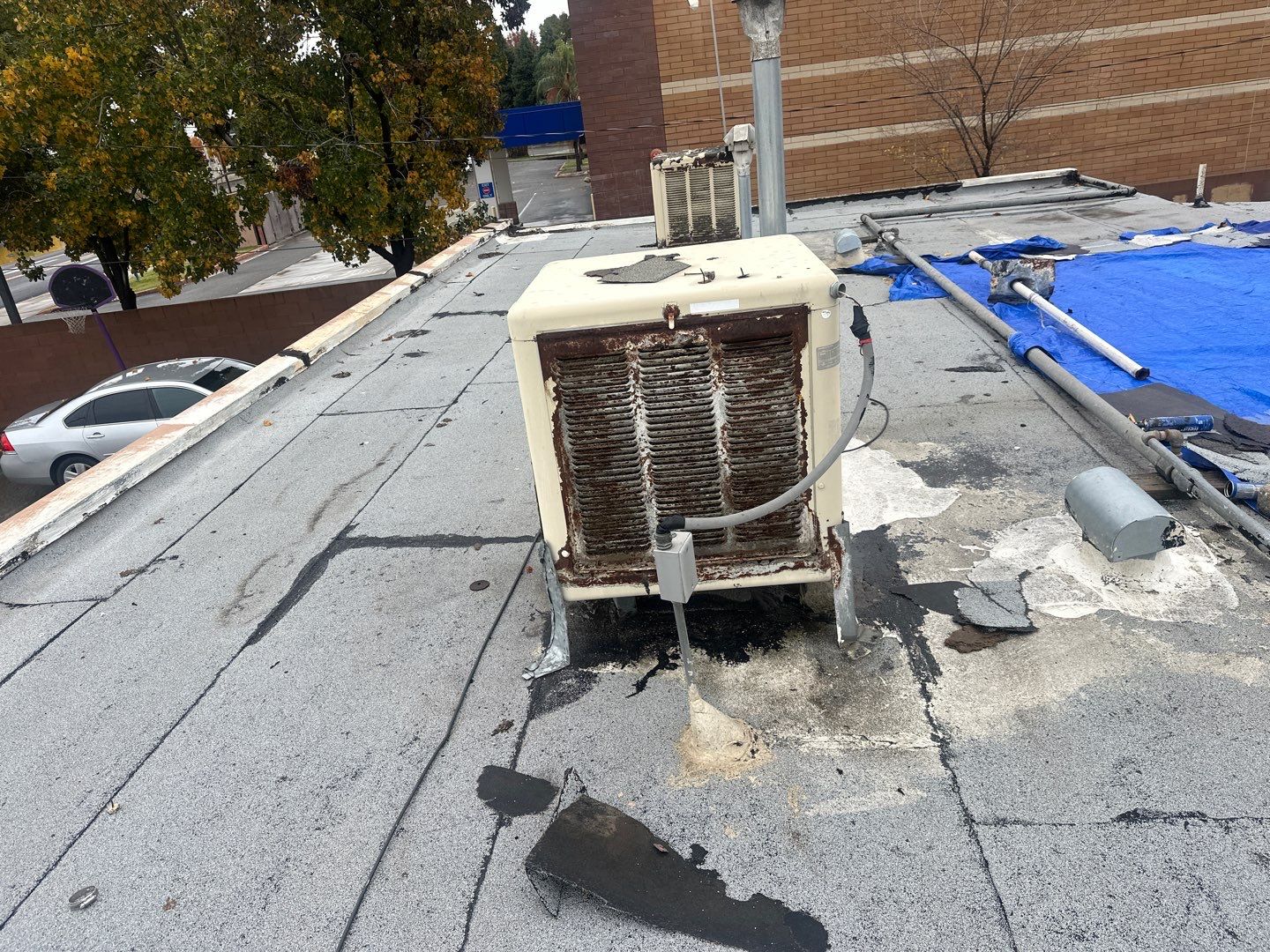 Emergency Roof Tarp Service - Fresno, CA by Grandmark Service Company